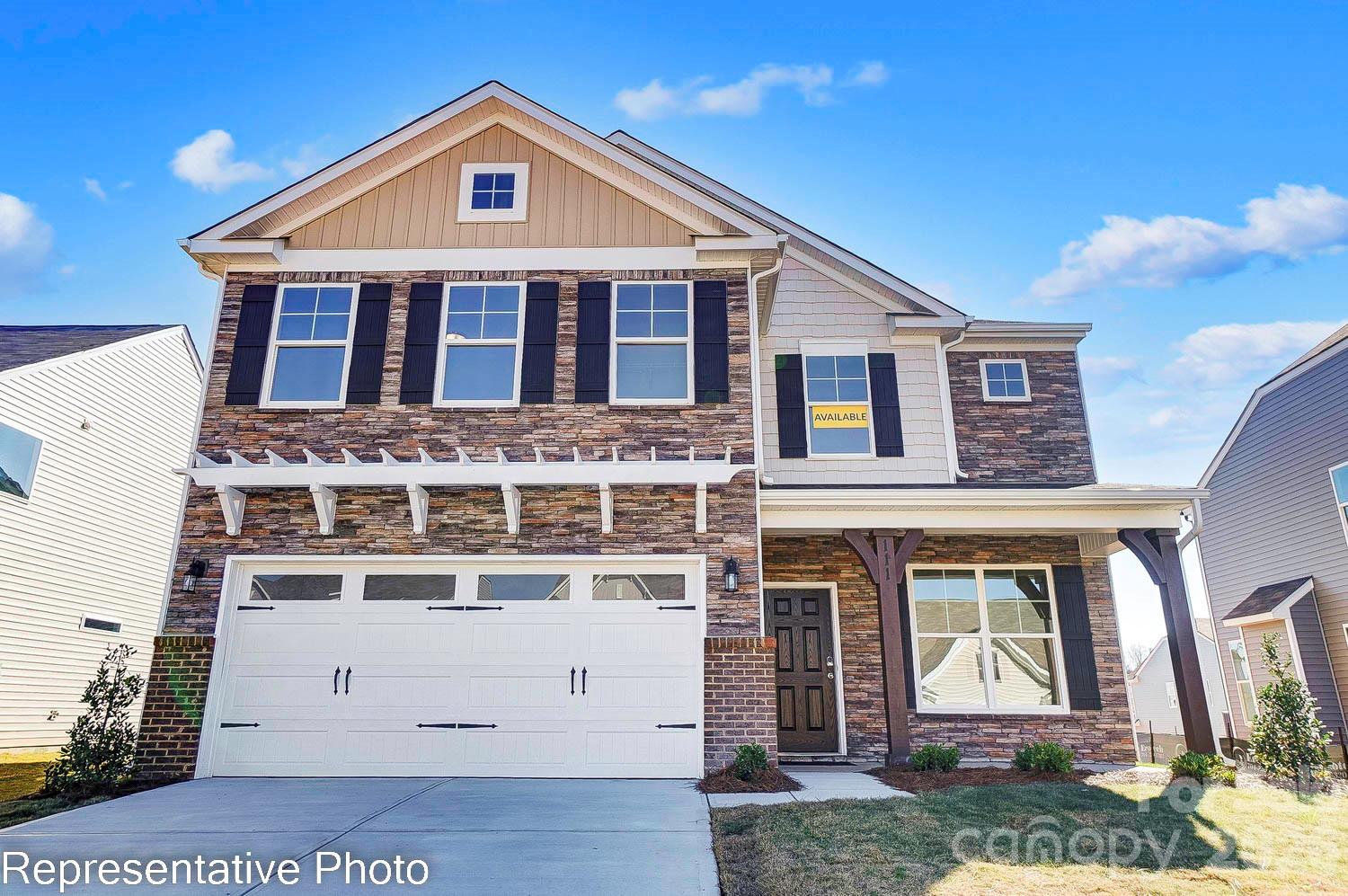 Located in Carrington's newest phase near Lake Norman, this beautifully designed Drexel plan offers 5 bedrooms, 3.5 baths, and more than 3,000 square feet of living space. The main level features a private office with dual full glass doors, powder bathroom, an elegant dining room with a tray ceiling, and a spacious family room with a gas fireplace, stone surround, and mantel. The designer kitchen opens to the family room and includes gray soft-close cabinetry, quartz countertops, a herringbone tile backsplash, stainless appliances, including a gas cooktop, wall oven, designer range hood, and a large island. The main-level primary suite features a tray ceiling and a luxury bath with a drop-in tub, tiled shower with a semi-frameless glass door, rain shower head with handheld sprayer, dual vanities, and a walk-in closet. Upstairs, you'll find three secondary bedrooms, two full baths, and a spacious loft. The third floor adds even more flexibility with a bonus room, an additional bedroom, and a full bath. Additional features include a covered rear porch with an adjoining 12' x 12' concrete patio, composite stair treads with metal balusters, a built-in drop zone, tankless gas water heater, and smart home features. Enjoy Carrington's exceptional community amenities, including a pool, cabana, pickleball courts, playground, and convenient access to Lake Norman, shopping, dining, and major highways.