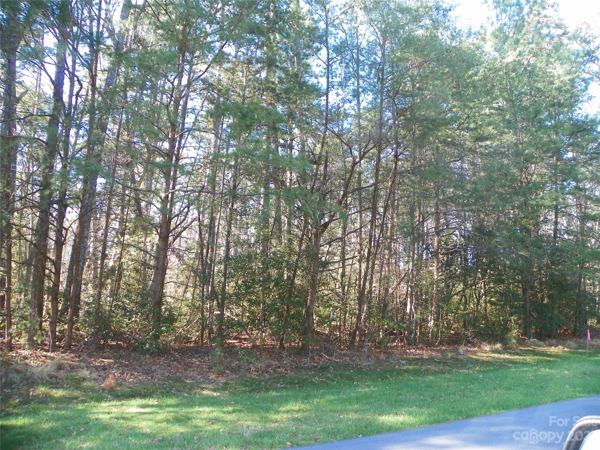 Build your dream home OR Lake getaway on this beautiful level .69 Ac. building site.  Near the entrance , located in beautiful gated Residential community of Heron Bay on Badin Lake!!  Recently surveyed and perked for 3 BR.  Enjoy all that this lovely community has to offer!  Lovely Clubhouse (reserve for your personal use-Owners), boat launch, boat storage facility (for a small fee), walking trails galore!  Just 1 hr. drive from Charlotte and Greensboro (major airports).  A VERY short distance to the Uwharrie National Forest!!  Come visit!! This just might be what you have been looking for!!!