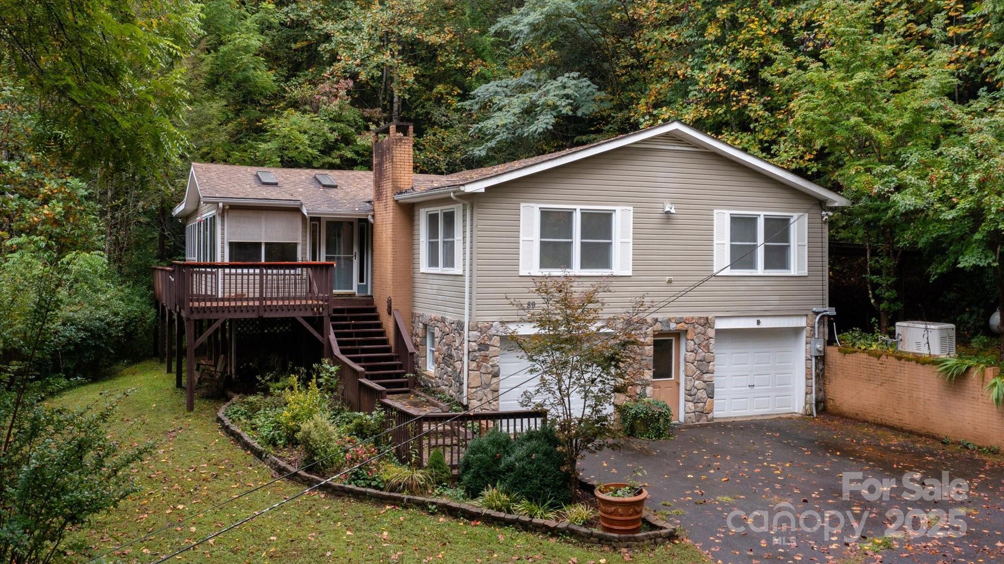 Conveniently located in the Little River area near Dupont State Forest in Pisgah Forest Farms, this 3 bed, 2.5 bath home sits on over 2  gentle acres. It includes a separate apartment on the lower level that is connected by an interior stairway and has its own exterior entrance too. Each floor offers main level living and has its own kitchen and laundry. Year round views of the valley and short range mountains.  Priced below appraised value, this home is a must see.