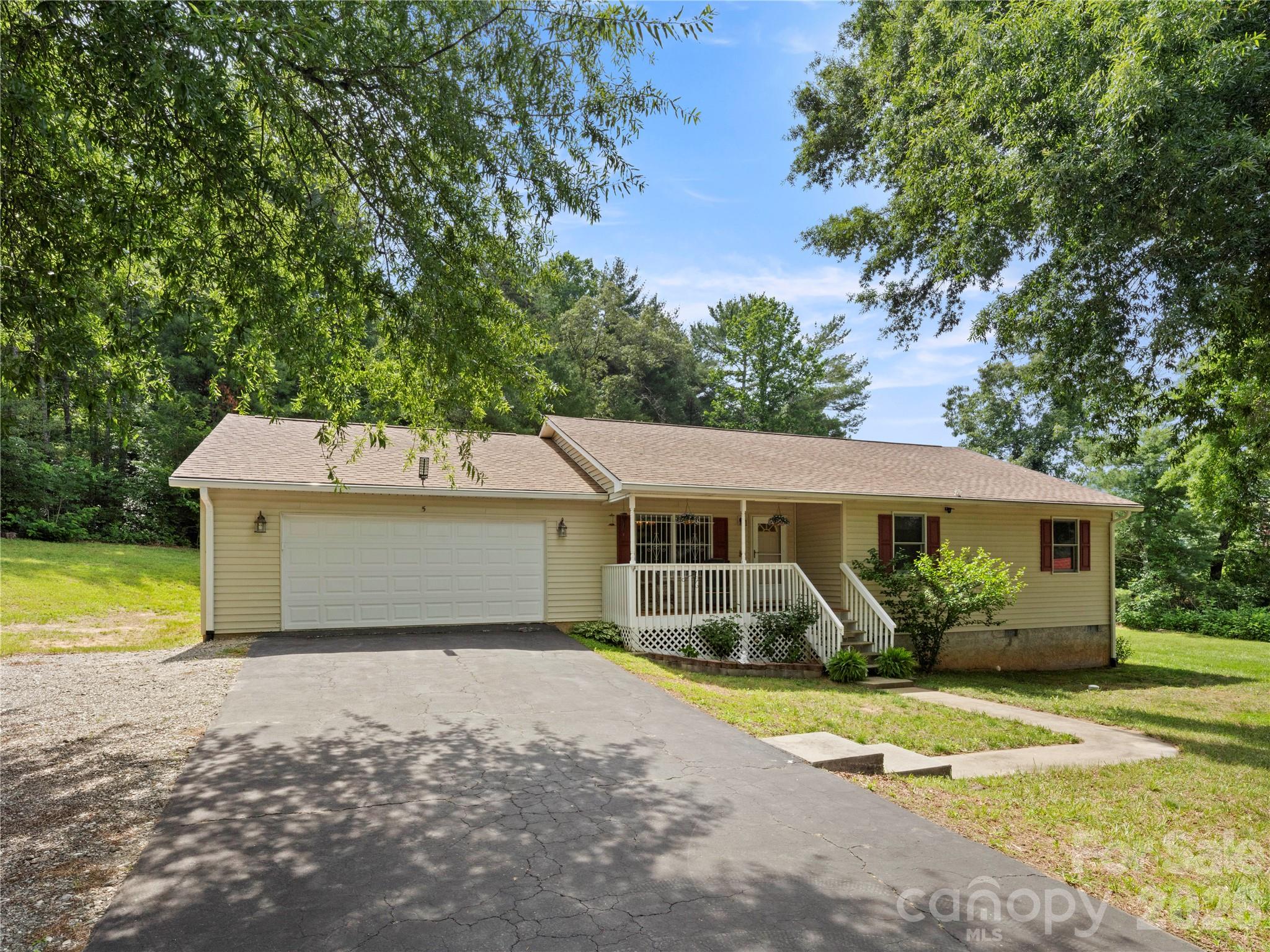 Enjoy easy one-level living in this well-maintained home on a cleared, mostly level corner lot in a convenient Swannanoa location. Built in 1995, the home features 2 bedrooms plus a dedicated office that offers excellent flexibility for remote work, hobbies, or additional living space. Beautifully updated luxury vinyl plank flooring flows throughout the main living space, while the renovated primary bath adds a touch of modern comfort. The functional floor plan includes a formal dining area, spacious living room, separate laundry room, and two full baths. Outdoor living is equally inviting with a covered front porch, a generous back deck, and a large yard offering plenty of room to enjoy the outdoors. An oversized 2-car garage adds plenty of space for vehicles and recreation. Conveniently located near shopping, dining, recreation, and everyday amenities in Swannanoa, Black Mountain, and Asheville.