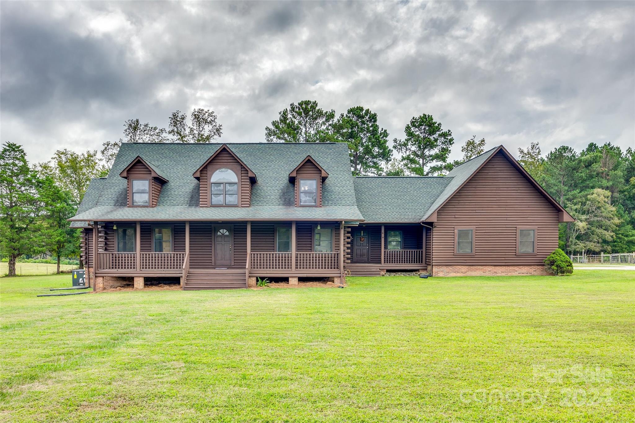 Welcome to 1430 Aaron Burr Rd Chester SC where rustic charm meets modern comfort. This 3-bedroom, 2.5-bathroom log home is nestled on over 16 sprawling acres of scenic countryside, offering the perfect blend of privacy and natural beauty. The property boasts a spacious horse barn, hay shed, 20x42 pole shed, and approximately seven acres fenced in. The barn is equipped with three horse stalls, a tack room, shop, storage and 2nd living quarters. As you explore the expansive land, you'll find lush pastures, a serene wooded area, and ample space for outdoor activities or future expansions. Step inside the home, and you'll be greeted by a thoughtfully designed kitchen that caters to all your culinary needs, with rustic touches and modern appliances. The exposed wood beams flow throughout the home, adding warmth and character, while enhancing the natural beauty of the log design. This property could be the turn key horse farm you've been waiting on! Book your showing today.