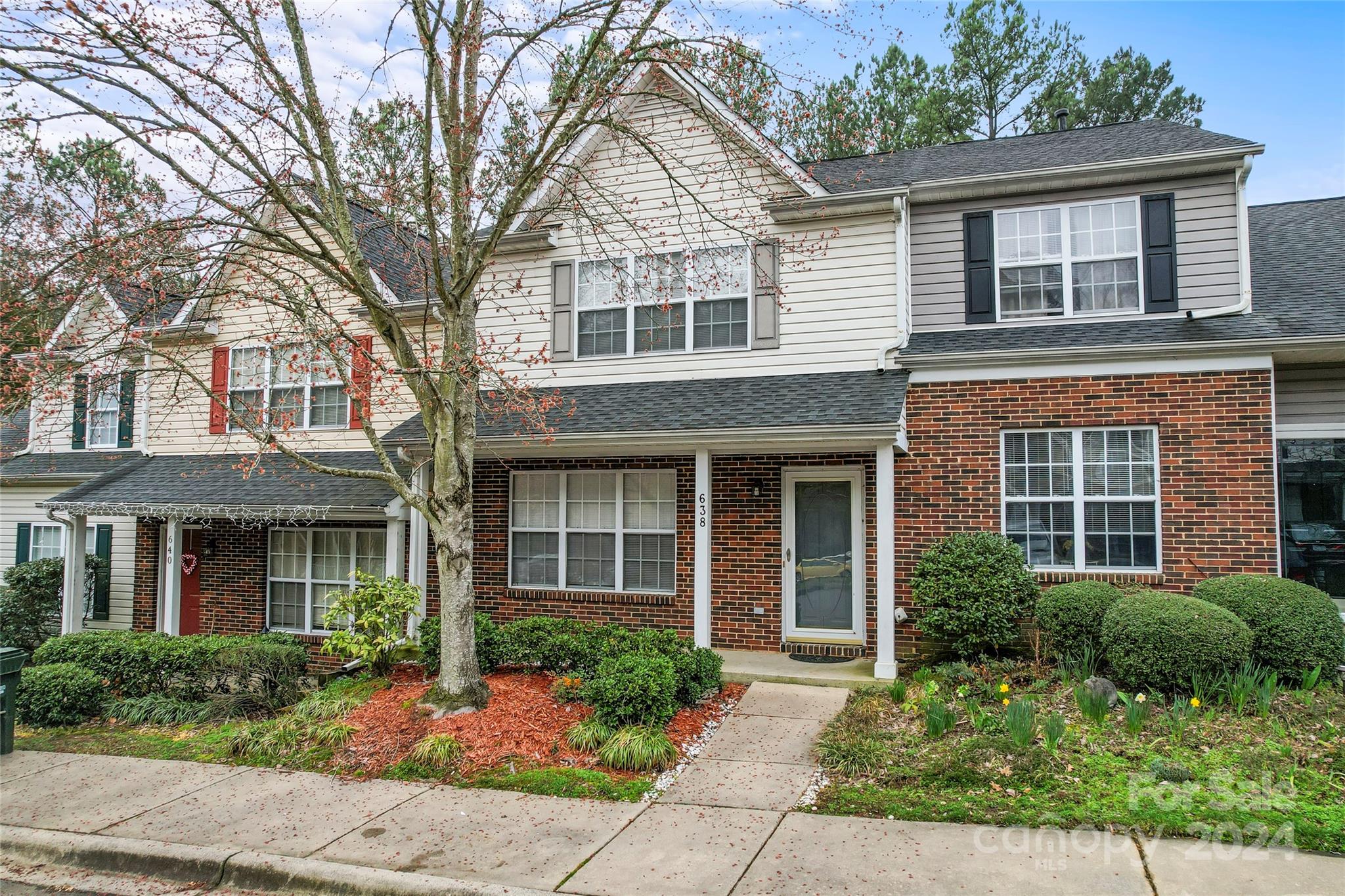 ADORABLE! Just what you have been waiting for! Perfect 2BR/2.5BA living in the University area with proximity to literally EVERYTHING. Shopping, dining, entertainment, education, sports, interstate access, the Lynx! Surprisingly oversized family room w/corner gas-log fireplace & ceiling fan connects to the roomy dining area. Durable laminate floor & fresh neutral paint throughout ready for you to apply your own personal style! Well-lit kitchen features granite counters, lots of cabinets, center island & ALL appliances (including refrigerator). Convenient laundry room comes complete w/washer/dryer & adjacent half bath completes the main level. Upstairs, you will find two spacious bedrooms each complete with their own bathroom & walk-in closet. Step out back & you are greeted by a cozy deck perfect for enjoying lazy evenings. A small exterior closet perfect for outdoor storage. Nestled back in the complex surrounded by trees, you will feel removed from the hustle & bustle.  Welcome Home!