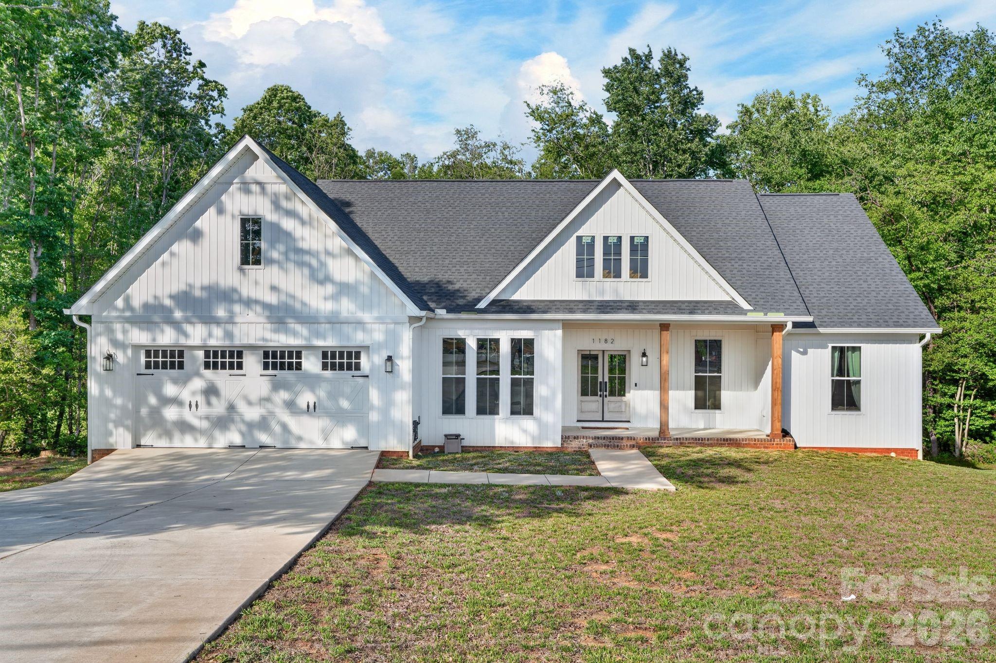 **BACK ON MARKET AT NO FAULT OF SELLER**** Beautiful home completed in 2022 offering the perfect blend of quality craftsmanship and convenience — all with NO city taxes and NO HOA! Situated on approximately .76 acres, this 3 bedroom, 2 bathroom home features 1,946 heated square feet plus an additional 1,946 square foot unfinished basement offering incredible potential for future expansion, workshop space, recreation area, or storage. Inside, you’ll find red oak hardwood floors, tall ceilings, custom trim work, designer lighting, sliding barn doors, and an open-concept layout centered around a cozy gas log fireplace. The kitchen features soft-close white cabinetry, granite countertops, stainless steel appliances, gas range, oversized island, and walk-in pantry. Spacious primary suite includes a spa-inspired bathroom with freestanding soaking tub, tiled walk-in shower, dual vanities with quartz countertops, and walk-in closet. Large laundry room with built-ins and oversized 2-car garage complete the home. Conveniently located near Lake Hickory, shopping, dining, and major highways.