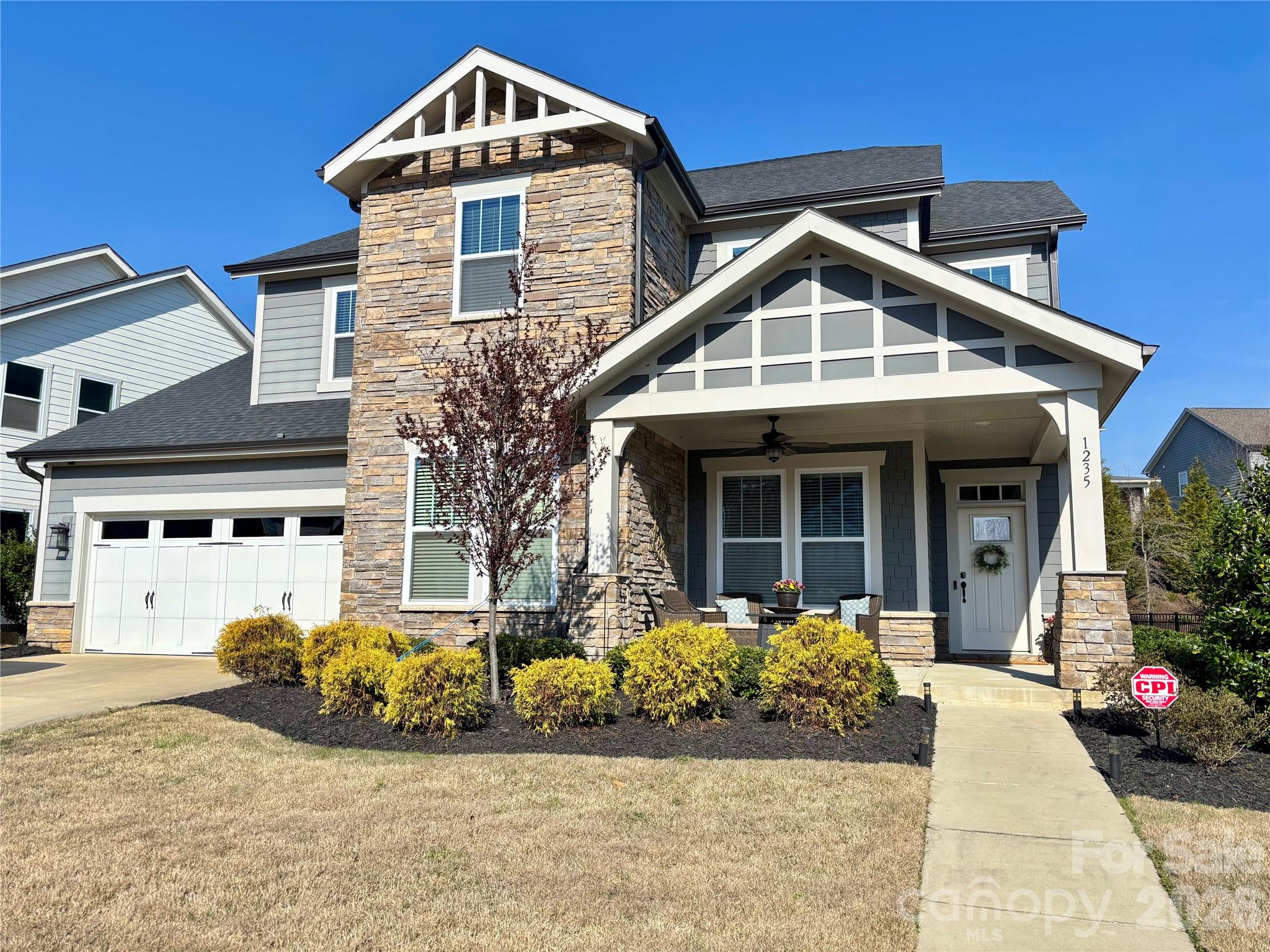 Turnkey living with landscape upgrades in sought-after Paddlers Cove—featuring TWO private offices, a rare find for today’s work-from-home lifestyle.  From the moment you step into the wide, welcoming foyer, this home delivers space, style, and functionality. The expansive living room is filled with natural light and anchored by a cozy fireplace—ideal for both everyday living and entertaining. Just off the entry, a true executive office showcases a full wall of custom built-ins and French doors, creating a polished and private workspace.  The gourmet kitchen is designed to impress with an oversized island, double ovens, gas cooktop, and an exceptional walk-in pantry—perfectly suited for both daily living and hosting.  Upstairs, the private primary suite offers a relaxing retreat with a separate sitting area and spa-like bath complete with a soaking tub. Three additional bedrooms feature generous closet space, while the versatile loft provides the perfect flex area for a game room, media space, or second living area.  Enjoy outdoor living year round with TWO entertaining spaces on the large front porch and the back porch with a beautiful stone gas fireplace and professionally enhanced landscaping that adds both beauty and value.  Located in Paddlers Cove, in a top rated school district, residents enjoy amenities including two community pools, clubhouses, walking trails, pickleball courts, playgrounds, and access to Field Day Park.