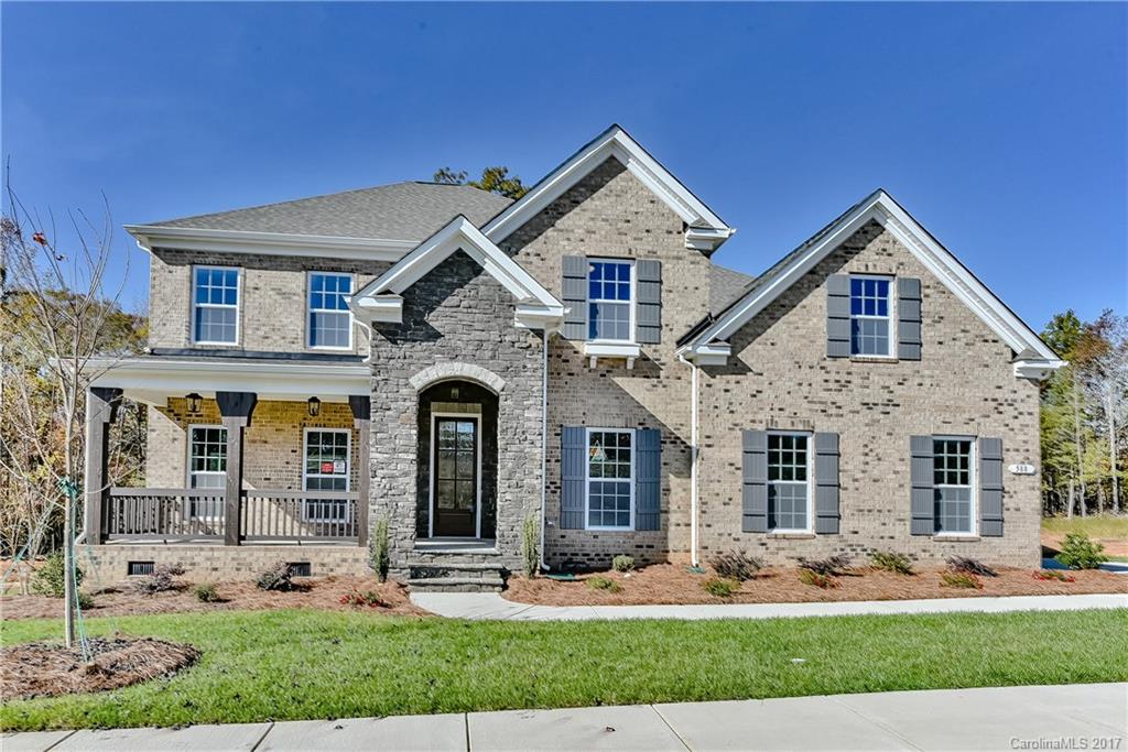 Amazing master down floorplan that offers formal living & dining, open kitchen w/ tons of cabinets & counter space, Butler's Pantry & open 2-story Family & Morning room w/ 2 fireplaces. Custom sliding doors from the Morning room open up onto a beautiful covered porch w/ a wooded view. Elegant home w/ arches & tons of trim details. Bonus Room upstairs. Great Fort Mill location w/ great schools & amenities that includes a pool, lazy river, clubhouse w/ fitness center, theater & playground.