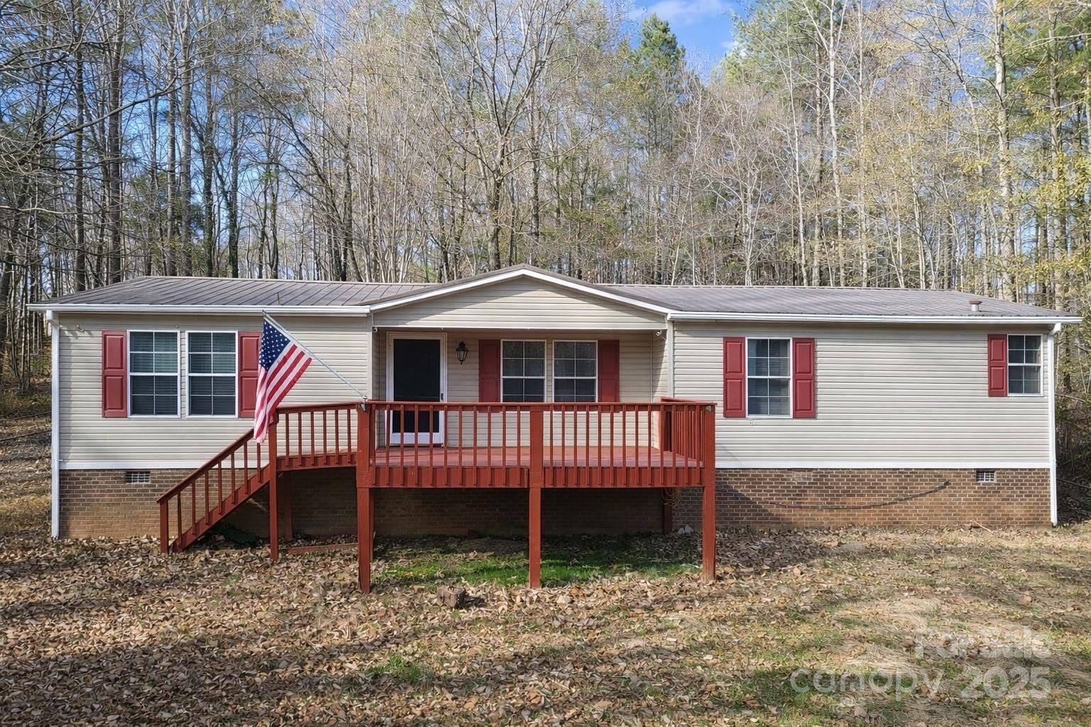 Tucked away on 3.01 wooded acres, this private 3-bedroom, 2-bath home offers the freedom of country living with no HOA. Surrounded by mature trees, the setting is quiet, peaceful, and perfect for those seeking space and serenity. Big-ticket improvements are already in place, including a 2019 metal roof, 2019 electric heat pump HVAC system, and a 2018 electric water heater. Relax on the welcoming front porch or enjoy evenings on the covered back deck while taking in the natural surroundings. With ample room for gardening, recreation, or simply enjoying the outdoors, this property delivers privacy, functionality, and long-term value.