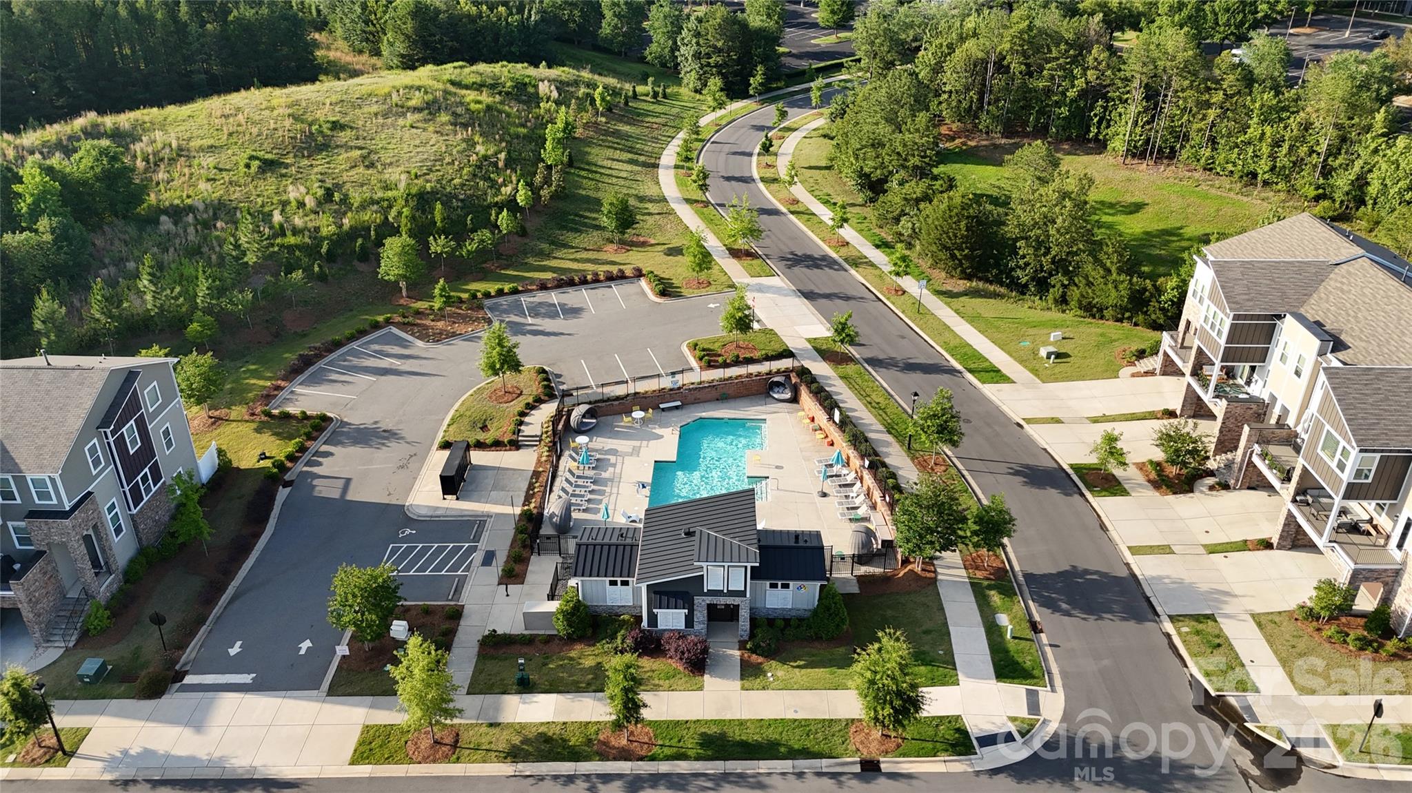 POOL COMMUNITY Featuring Three Levels of Modern Living in the Heart of Charlotte!!
Welcome to a striking contemporary townhome close to Uptown Charlotte and 56 plus miles of Greenway access! Featuring a thoughtfully designed living space across three levels — built in 2022 with clean urban lines, stone veneer accents, and an oversized two-car garage.
The first floor welcomes you with a gracious foyer and a private guest suite — a full bedroom with its own full bath and a covered porch — ideal for visitors, a home office, or multigenerational living.
The main living level is where this home opens up. A spacious open-concept design connects a generous dining area, a massive living room stretching nearly 23 feet wide, and a stunning kitchen anchored by an oversized island with seating. Built for entertaining, the kitchen offers abundant cabinetry, a gas cooktop, microwave, dishwasher, disposal, and a dedicated walk-in pantry. Sliding glass doors open onto a large private balcony for morning coffee or evening gatherings, and a convenient powder room completes the level.
The top floor is a true private retreat. The primary suite features a spacious bedroom, a spa-style bath with dual vanities, a separate soaking tub and walk-in shower, and a large walk-in closet. Two additional generously sized bedrooms, full baths, and an upper-level laundry room round out the floor — no hauling baskets up and down stairs.
Additional highlights include an energy-efficient heat pump system, central heating, electric water heater, electric dryer hookups, and a level entry for easy accessibility. Perfectly positioned just minutes from Uptown Charlotte, the airport, and the major employers of University Research Park.
4 Bedrooms · 3.5 Baths · 2-Car Garage · ~2,398 Sq Ft · Built 2022