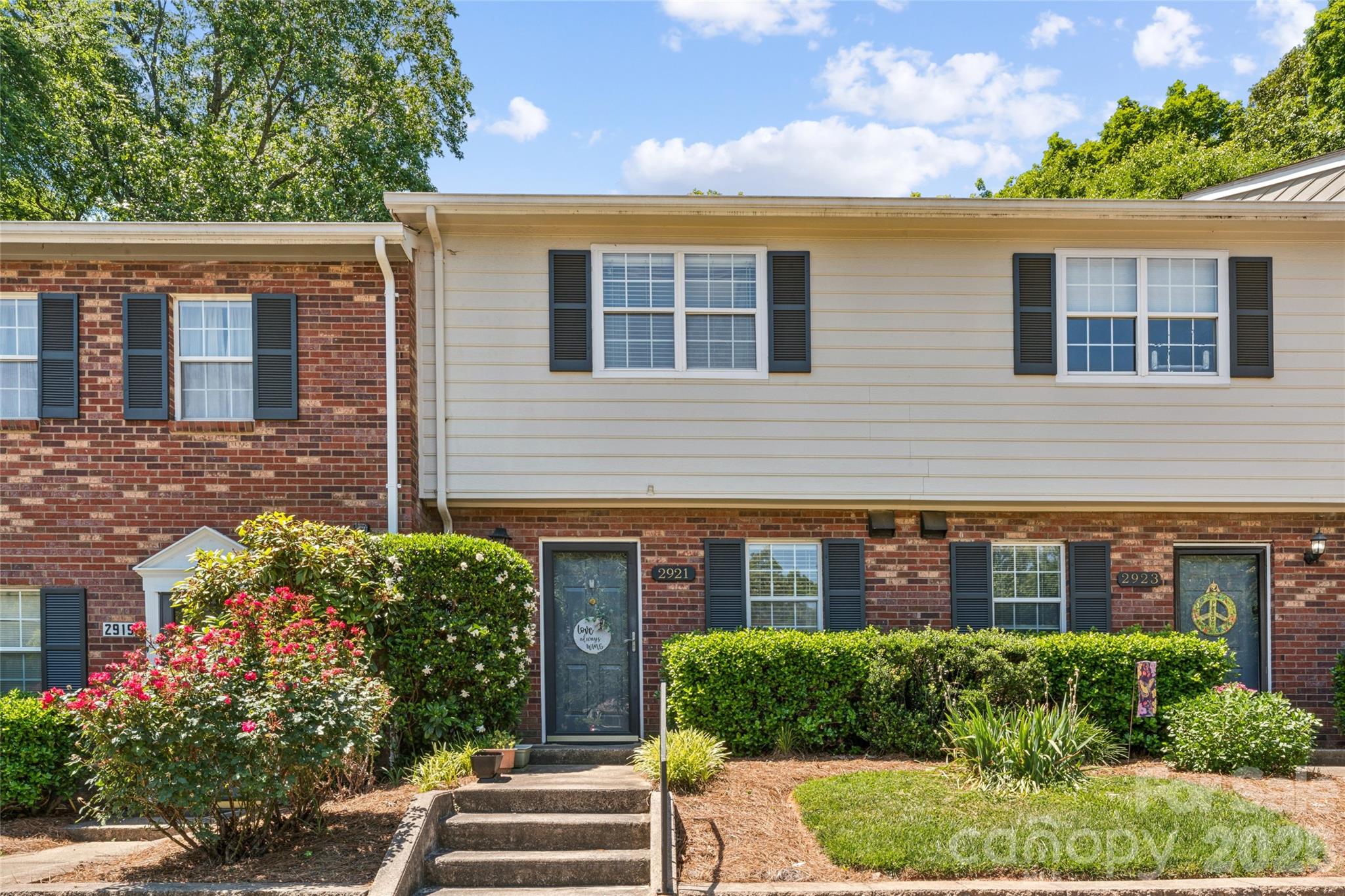 2921 Heathstead Place offers the highly desirable 28210 lifestyle without the SouthPark price tag. Located in the established Heathstead community, this 2 bedroom, 1.5 bath home is just minutes from SouthPark, dining, entertainment, and luxury retail experiences. Enjoy convenient access to the LYNX Light Rail with quick connectivity to South End, Uptown Charlotte, Pineville, and University City, making it easy to enjoy everything Charlotte has to offer. Inside, the home features a cozy wood burning fireplace, two assigned parking spaces, and a private fenced patio backing to a wooded area for added privacy and outdoor enjoyment. An exterior storage closet provides additional storage space. Seller states the roof was replaced approximately 3 to 4 years ago and boasts a new water heater! Heathstead is known for its mature landscaping and outstanding community amenities including two outdoor pools, tennis courts, sidewalks, streetlights, scenic walking trails, and a clubhouse located in the historic Heath Farm Mansion. Prime location near Quail Hollow Country Club, Quail Corners, Park Road Park, Greenway Trailheads, and SouthPark. Offered below tax value, this is an excellent opportunity in one of Charlotte’s most convenient and desirable areas.