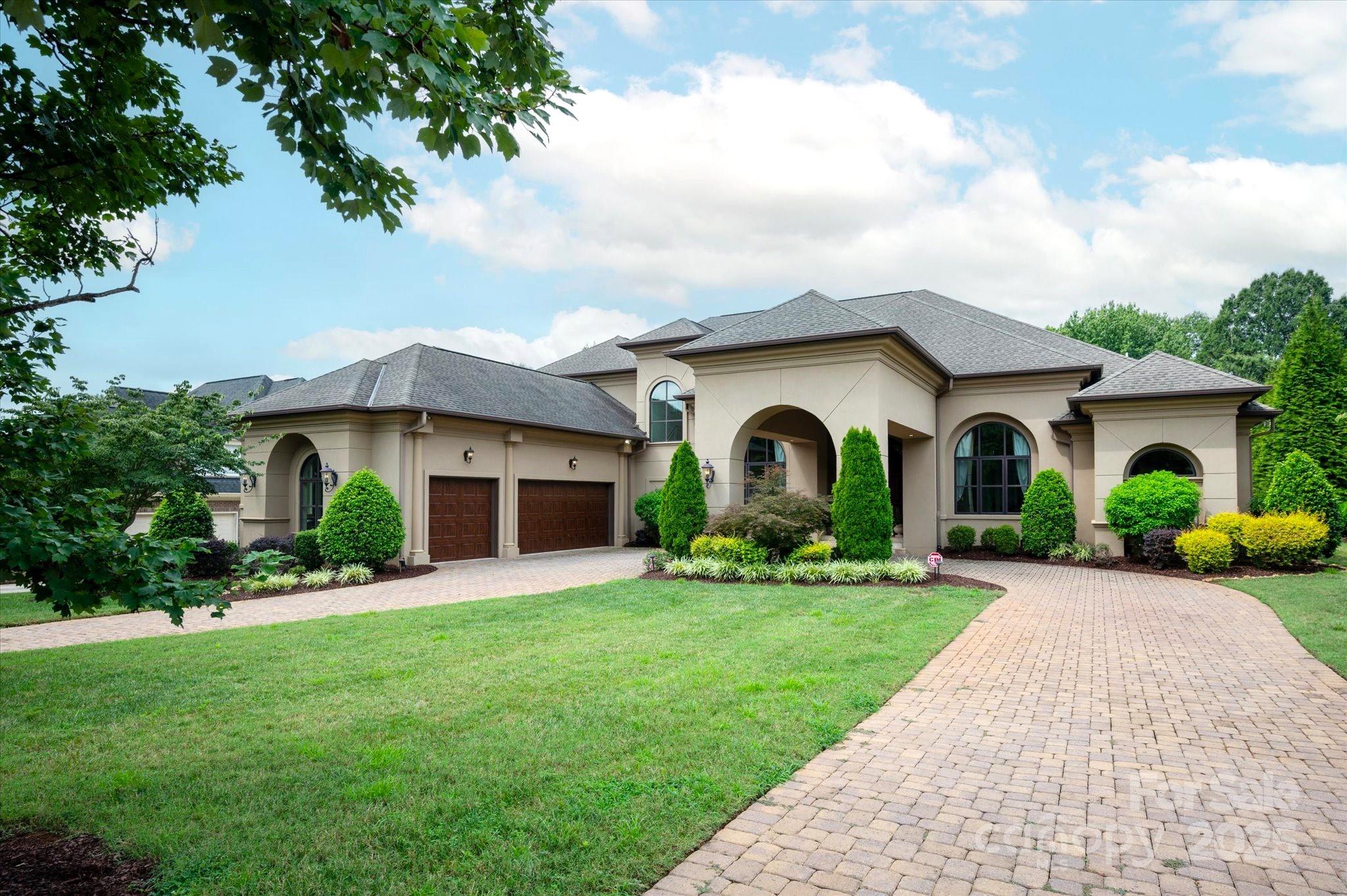 Stunning custom built home offers generous space for comfortable living and entertaining, with soaring ceilings, white oak floors throughout, 6 BDRS, 6.5 baths, office, billiard room, porte-cochere, and 3 car garage.  The home offers so many upgrades including an elevator, circular paver driveway, mahogany custom entry door, Wolf/Subzero appliances, surround system in family room, 3 Carrier AC unites with 8 zones, and 10-zone sprinkler system.  Primary on main with luxury spa bath and his/her walk-in closets.  Covered rear porch on main level with a fireplace and a grill and a huge terrace on 2nd level.  So many features to include so come and check it out!