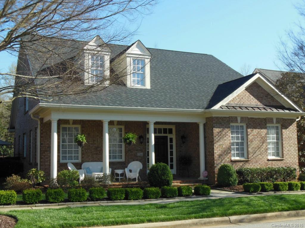 Custom built home-quality abounds! Relaxed feeling with large covered front porch overlooking the green & fountain. Open floor plan with wood floors throughout. Lovely sunroom overlooking private courtyard. Spacious main level master suite. Fireplace in great room can be enjoyed from kitchen with dining bar. Bose built-in speakers throughout to remain. 5-Zone irrigation.