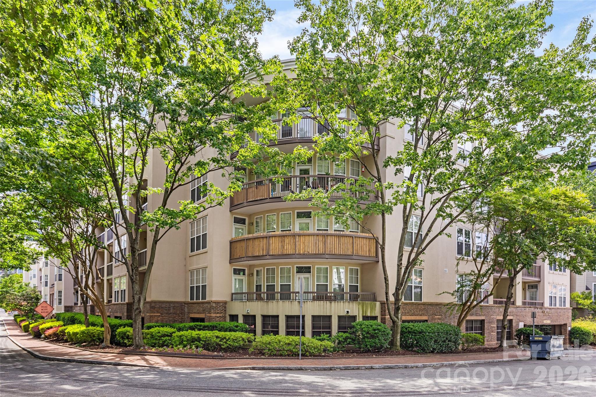 Welcome to this spacious top-floor condo in the heart of Fourth Ward, offering one of the larger floor plans in the building. With three bedrooms and two full bathrooms, this unit combines functional living with an unbeatable Uptown location. Inside, you’ll find a thoughtfully designed layout with generous living spaces, an updated kitchen, and a cozy fireplace anchoring the living room. The kitchen features timeless white cabinetry and a beautiful backsplash. Just off the main living area, a small private balcony offers the perfect spot for morning coffee or fresh air. The oversized primary suite features a large walk-in closet and updated en-suite bathroom with a beautiful tile shower, while two additional bedrooms and a second full bath provide flexibility for guests, office space, or everyday living. In-unit laundry adds convenience, and elevator access makes top-floor living easy. Residents enjoy gated, assigned parking along with an overflow lot for guests and visitors. The building also features a shared rooftop terrace with grilling area and spectacular Uptown skyline views. Another bonus is the updated HVAC system (2023). Enjoy the charm of historic Fourth Ward with close proximity to Uptown dining, parks, entertainment, and a convenient Harris Teeter just across the street!