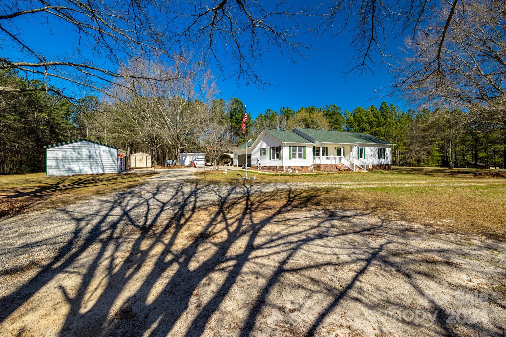 Don't miss out on this incredible opportunity! Take hold of the chance to own this delightful 3-bedroom, 2-bathroom home situated on approx. 1.85 acres in Lancaster, SC. Boasting generous space and abundant potential, it presents the ideal canvas for crafting your dream space. This property also features a 20x25 2-bay shop, a 10x12 shed, a 16x12 shed with a 10-foot lean-to, and a detached carport. Call now to schedule your showing!