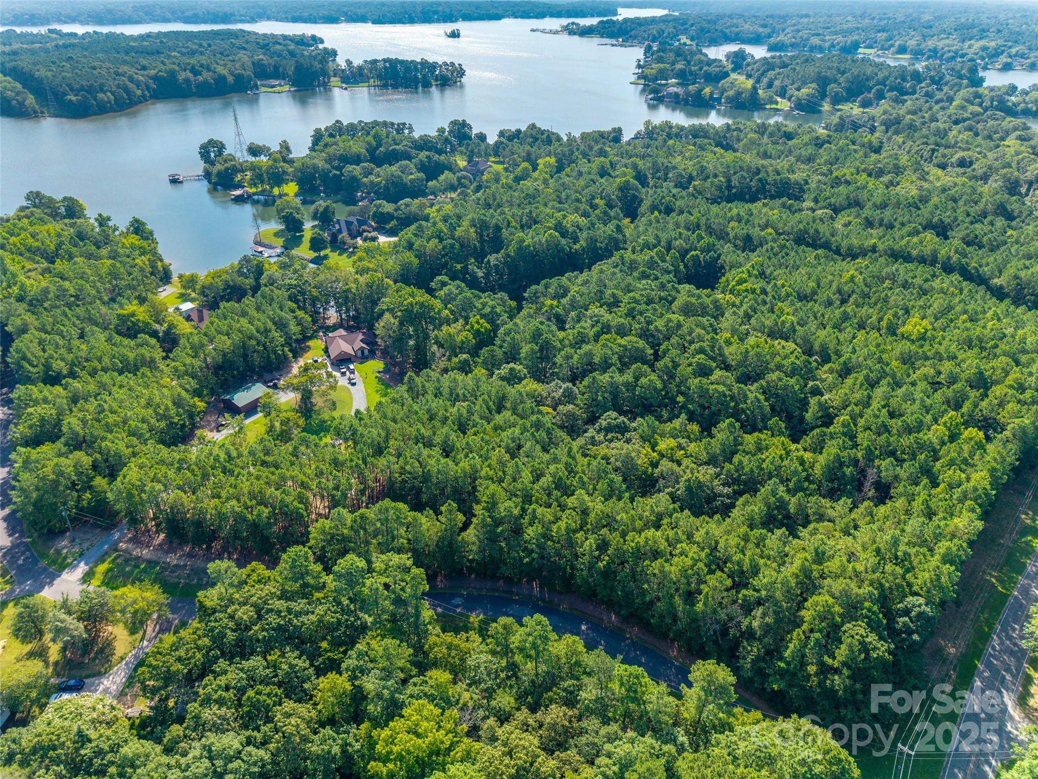 Build your dream home on this beautiful 2-acre lot! A short drive down Allison Creek Road, close to established neighborhoods and the lake, and minutes from the Allison Creek boat landing. Seller has a septic permit for a 4-bedroom home. Award winning Clover Schools and no HOA!