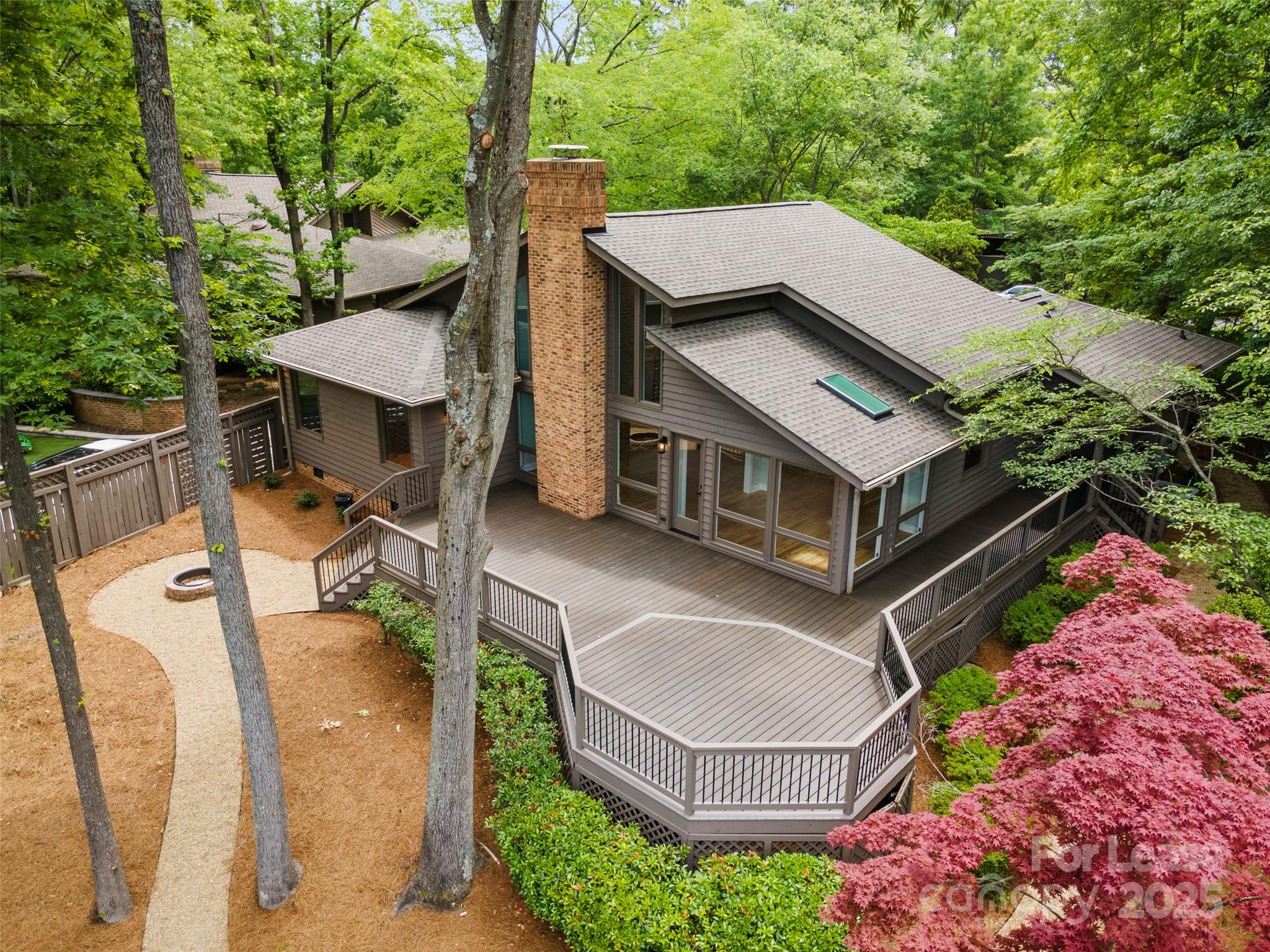 Dream Location! Completely updated Waterfront "Ranch" Home located in a quiet community within walking distance to grocery, restaurants, & the Town of Davidson. Beautifully updated inside with new floors, cabinets, countertops, lighting, baths, deck, appliances, and more. Open floorplan with huge floor to ceiling windows for enjoying the fabulous lake views. This home features a Soaring ceiling in the great room with a new electric (no mess) fireplace. The primary suite has stunning lake views & a luxury primary bath with soaker tub & walk-in shower. Beautifully updated kitchen features gorgeous high end "Cafe" Appliances, Quartzite Countertops with tile backsplash & plenty of cabinets and a pantry. The Outside is a hidden paradise. A huge private Trex deck with plenty of space for entertaining, a fantastic lake view and a firepit with a spacious yard and no grass to maintain. Just a short walk to the community pool and pickleball court. Community has direct access to walking trails.
