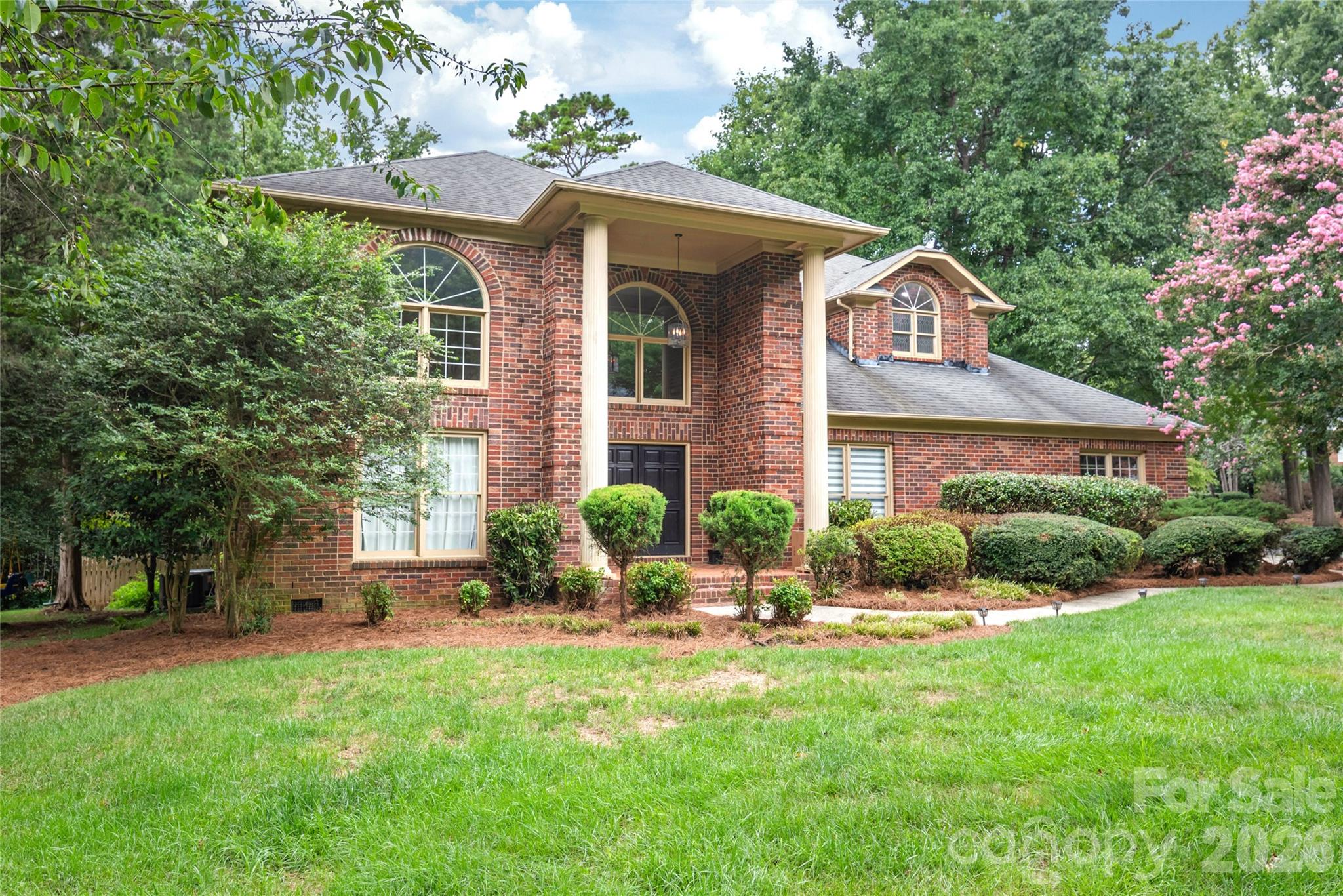 Welcome to this stunning custom-built full brick home, where timeless elegance meets an unbeatable South Charlotte lifestyle. Featuring 5 bedrooms and 3.5 baths, this beautifully maintained residence is filled with natural light thanks to expansive windows that brighten every living space.

Step through the impressive two-story foyer and be greeted by a dramatic double staircase that sets the tone for the home's sophisticated design. The thoughtfully designed floor plan offers spacious living and entertaining areas, while the main-level guest suite with a full bath provides the perfect retreat for visitors, multigenerational living, or a private home office.

Outside, enjoy a beautifully landscaped yard complete with a large rear deck, charming paver walkway, and fenced backyard ideal for relaxing, entertaining, or outdoor gatherings.

Location is everything, and this home delivers. Walk to Trader Joe's, Starbucks, restaurants, and the 4 Mile Creek Greenway. Just minutes from The Arboretum, Stonecrest, Ballantyne, SouthPark, and Uptown Charlotte, you'll enjoy convenient access to shopping, dining, recreation, and major employment centers.

A rare combination of quality construction, exceptional location, and timeless design. Schedule your private showing today and experience everything this remarkable home has to offer.