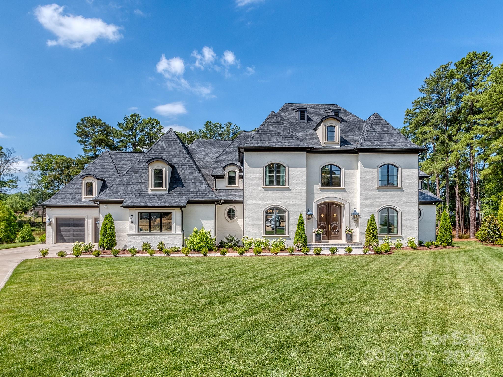 Why wait to build when you can buy a 1 year old, exquisite Lakefront home in Twin Lakes? This Fosselman Construction masterpiece offers a luxurious living experience perfect for daily life & entertaining. Featuring 4 Bedrooms, 5.5 Baths, & Open Floor Plan. The Gourmet Kitchen w/ Waterfall Countertops, full Scullery w/ Double Ovens, storage for provisions & daily countertop appliances, Dishwasher, & Prep Sink. The Indoor/Outdoor Great Room, Main Floor Home Office, Primary Suite w/ 3 Walk-in Closets, fabulous Bath, Sauna, and private Laundry make this home a standout. Upstairs, you'll find 3 generously sized Bedrooms, each w/ Ensuite Baths & Walk-in Closets, a Bonus & Fitness Rooms, Flex Space, & abundance of Storage. Outside, there are 2 Covered Patios, a Fireplace, Firepit, Outdoor Kitchen, & stunning Saltwater Pool w/ Hot Tub, Pool House, complete with a Wet Bar, Rec Room, & Full Bath, is perfect for all your entertaining needs. This home is truly spectacular and not to be missed!