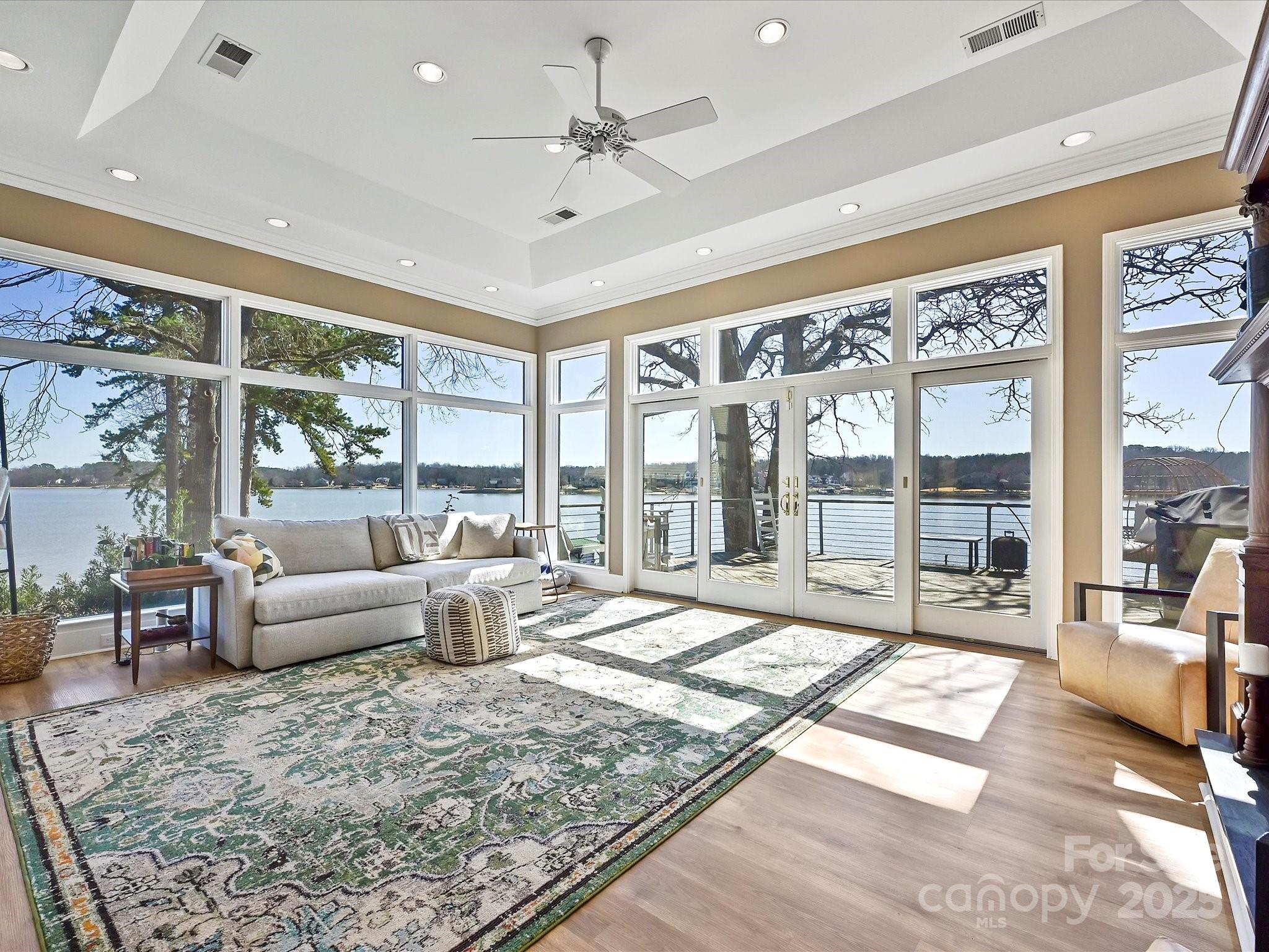Enjoy Fabulous SUNSETS & PANORAMIC VIEWS of Main Channel Lake Wylie in this classic Tega Cay waterfront beauty.Open and spacious,this split foyer tri level has a minimum of steps and fabulous lake vistas from nearly every room.Great Room window wall gives breathtaking views of Wylie.The Kitchen is open and has paneled appliances, industrial-sized stainless fridge, gas cooktop,double oven, microwave, wide granite counters,lots of cabinets,and a breakfast island, plus Formal Dining. A trio of Bedrooms, Laundry Room,and Hall Bath with Walk-in-Tub are three steps up. Primary Suite is on the lower level with lower deck access and wonderful lake views.The Upper Level features a large Bonus Room/Den. Dual decks are perfect for entertaining, reflection, and surveying lake activity. Deep water dock has large sunning area, swim ladder, and stairs for kayak launch. Nearly $250k in upgrades with dock, roof, HVAC, siding, fence, retaining wall. No HOA! Amenity rich n'hood. Award winning schools!