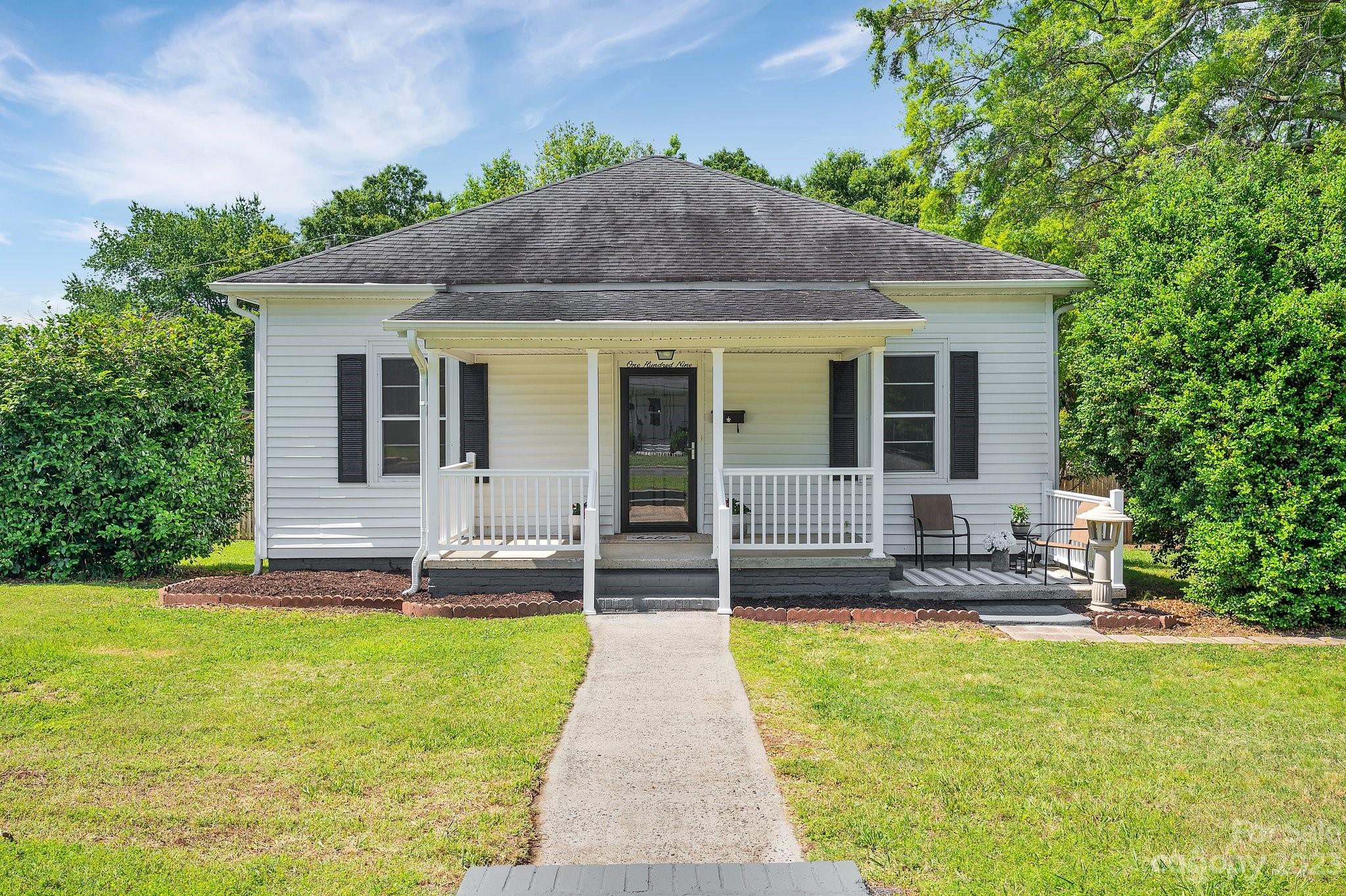 This old millhouse has had a refreshing update with some original character remaining! LVP flooring throughout the main living areas and new carpets in the bedrooms. The kitchen has new granite counter tops, hardwood cabinets and original built-in hutch. The backyard is gently sloped and fully fenced in with a large storage shed. NO HOA! Located within walking distance to restaurants, antique stores, and right around the corner from New Centre Park with a brand new playground and splash pad! Home is being sold as-is with no known defects.  Located within the highly sought after Clover School District. This would be a perfect opportunity for an investor to buy and hold! Agent is part owner.