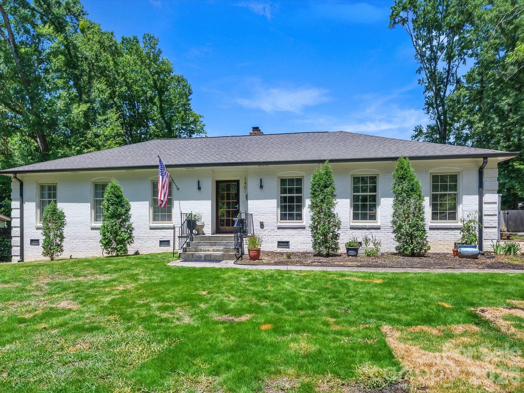 Stunning renovation in the heart of Sherwood Forest! This home is the perfect blend of timeless charm and modern updates. The open floor plan, abundant natural light, and thoughtfully designed living spaces create a warm and inviting feel from the moment you step inside. The living room features a gas fireplace, custom mantel and a built-in bar with glass-front cabinets. The beautifully renovated kitchen showcases a vaulted ceiling with skylights, white soft-close cabinetry, leathered marble countertops, a marble tile backsplash, a gas range with vent hood, under-cabinet lighting, and a built-in pantry with pull-out shelving. The spacious dining area easily accommodates large gatherings, while the adjoining flex space is perfect as a sitting room, den, or home office. The primary suite offers a walk-in closet and a beautifully renovated bathroom with white cabinetry, marble countertops, and a marble-tiled shower with a frameless glass enclosure. The secondary bathroom is equally impressive, featuring white cabinetry with a marble vanity, soaking tub and heated towel warmer. Hardwood floors and recessed lighting run throughout the home, and each bedroom features a custom closet organization system for added storage. Just off the main living area, the sunroom offers additional living space and a seamless connection to the backyard. Step outside to a newly built two-tier patio featuring an electric fireplace and fire pit overlooking the large, level backyard. The exterior also includes a storage closet and large shed, providing plenty of space for lawn equipment, bikes, toys, and more. Every detail reflects quality craftsmanship and thoughtful design, creating a home that beautifully blends character and comfort.