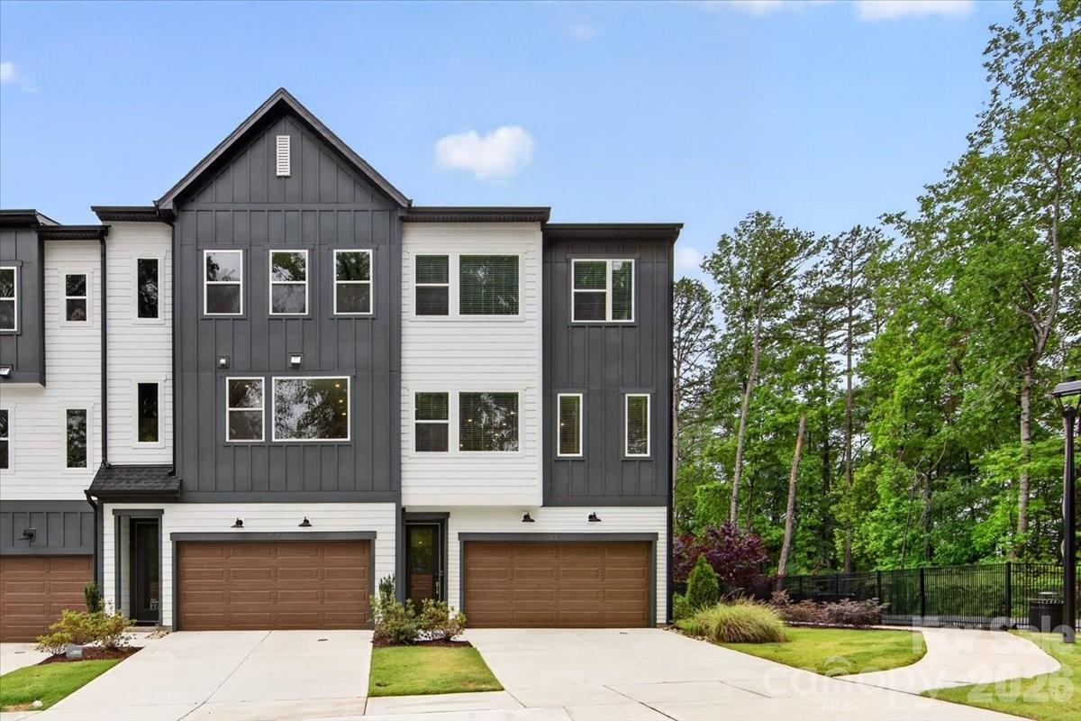 This end-unit townhome in the boutique Archer Row community offers 4 bedrooms, including a first-floor guest suite with full bath. The gourmet kitchen features quartz countertops, stainless GE appliances, and a convenient package for everyday living. The bright, open living area includes a 12-foot sliding door leading to one of two outdoor living spaces. The private primary suite offers a spa-inspired shower, while high ceilings and added windows fill the home with natural light. Tucked against mature trees next to the community dog park and near guest parking, this home is convenient to Uptown, I-77, and the airport.
