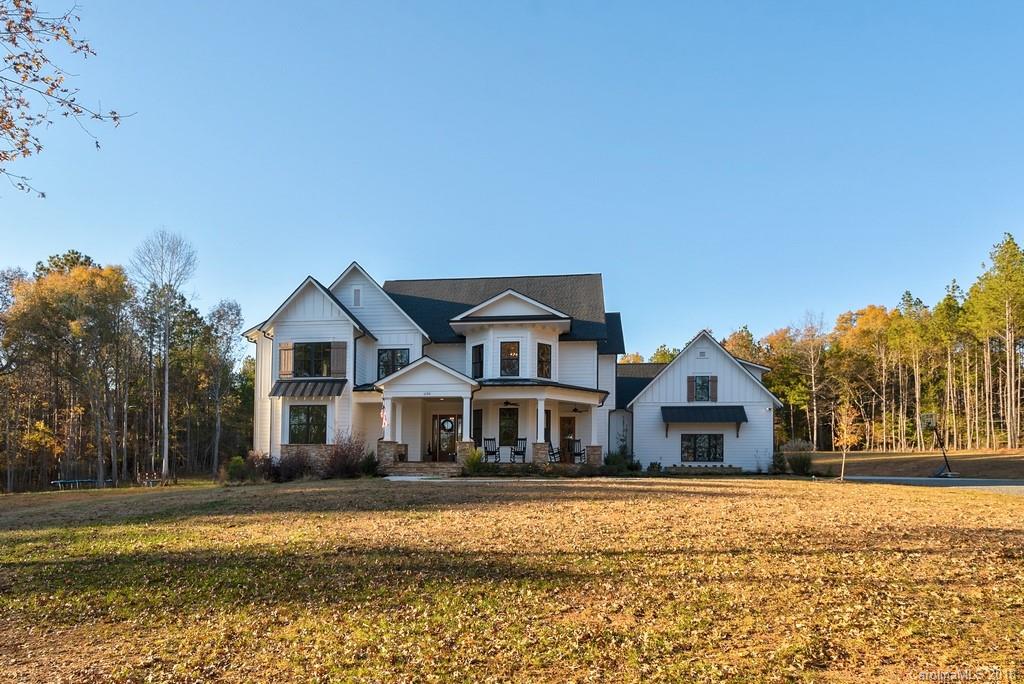 Like New Custom Built home tucked away overlooking a pond.  Attention to quality details throughout, including honed granite, SS Appliances, subway tile, an oversize laundry room w/pantry w/sliding barn door, drop station, dutch doors, hobby/school room.  Multiple built-in's.  Main Floor guest room & full bath.  Tile, frameless glass shower enclosures. Wood beams, ship lap & bead board accent walls, character grade Hickory HW floors in all rooms except bathrooms & bonus.  Large Office main floor.  Built-in bunk beds, walk-in closets.  Outdoor living space includes covered back deck & large front porch. Community offers miles of walking, riding trails, 9 acre lake for fishing & canoeing.  All just 6.5 miles to new Promenade shopping Center & 20 minutes to Ballantyne.  Back yard graded & ready for your pool. All the new home kinks have been worked out & now you can enjoy stress free living & an outdoor lifestyle.  Horses allowed & several in the community.