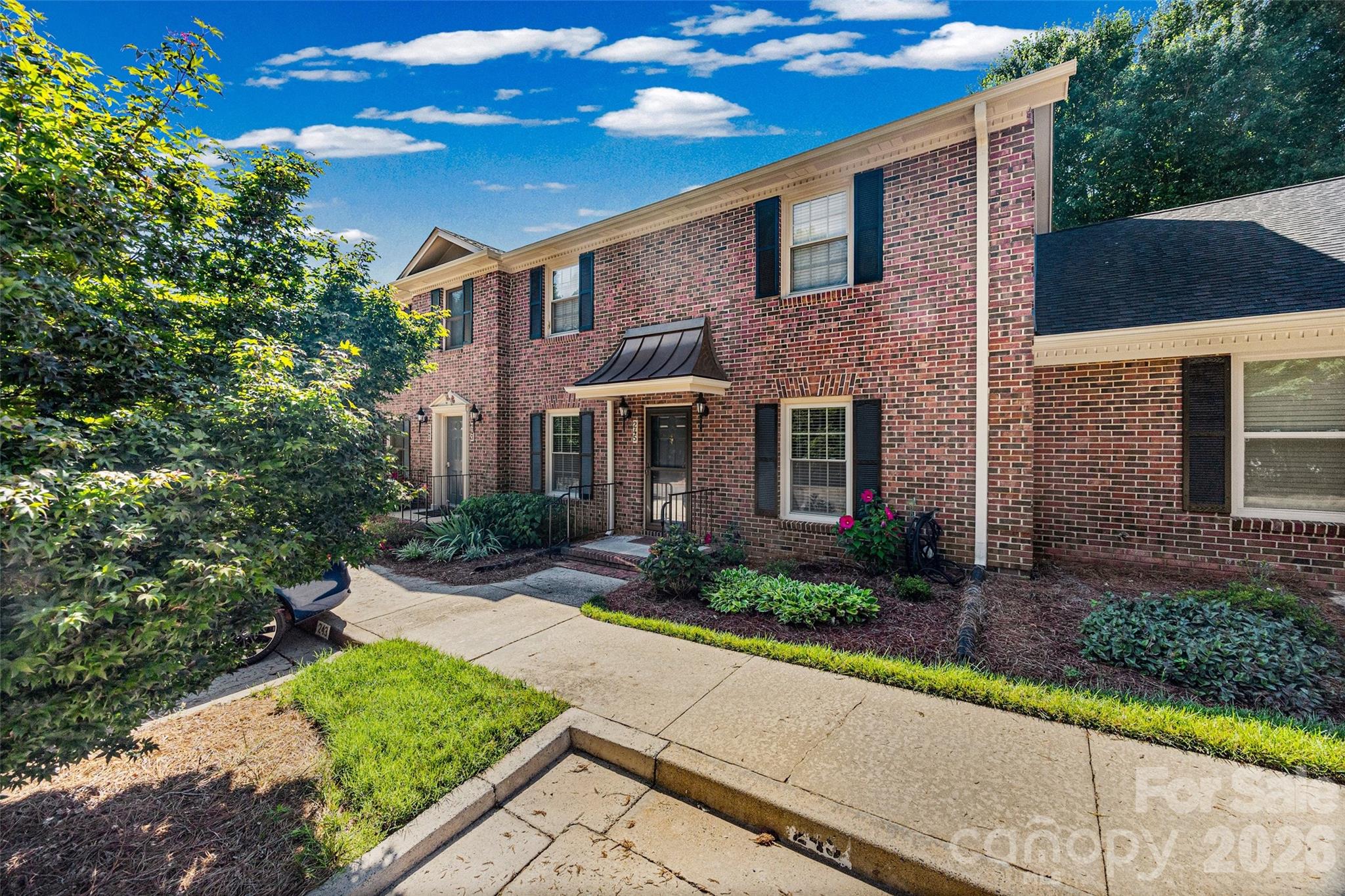 Welcome to Olde Pointe, one of Rock Hill’s most established and well-loved condo communities—perfect for those seeking comfortable, single-level living with minimal upkeep. This beautifully maintained 2-bedroom, 2-bath home offers a peaceful setting surrounded by mature landscaping and a friendly neighborhood feel.

 The home features brand new carpeting throughout and was just freshly painted. Spread out and enjoy the spacious living and dining area designed for easy movement and everyday comfort. The large eat-in kitchen includes a pantry and a convenient laundry closet, keeping everything within easy reach. Enjoy the covered front porch for relaxing outdoors and an enclosed back porch with additional storage—ideal for hobbies, gardening supplies, or seasonal holiday items. 

The primary suite offers two generous closets and a private bath with a walk-in shower. The second bedroom comfortably fits a queen-sized bedroom set, making it perfect for guests or a quiet reading room.

All appliances—including the washer and dryer—convey, making your move seamless. The community offers gated access to the nearby Food Lion shopping center, allowing for effortless errands. You’ll also enjoy close proximity to the hospital, medical offices, dining, shopping, the post office, and more—everything you need just minutes away. Great central location. Minutes from 77. 

Recent community updates include new roofs, new gutters, and freshly painted exteriors (2025), ensuring long-term peace of mind.

This is low-maintenance, convenient living at its best—perfect for those who value comfort, accessibility, and a welcoming neighborhood.