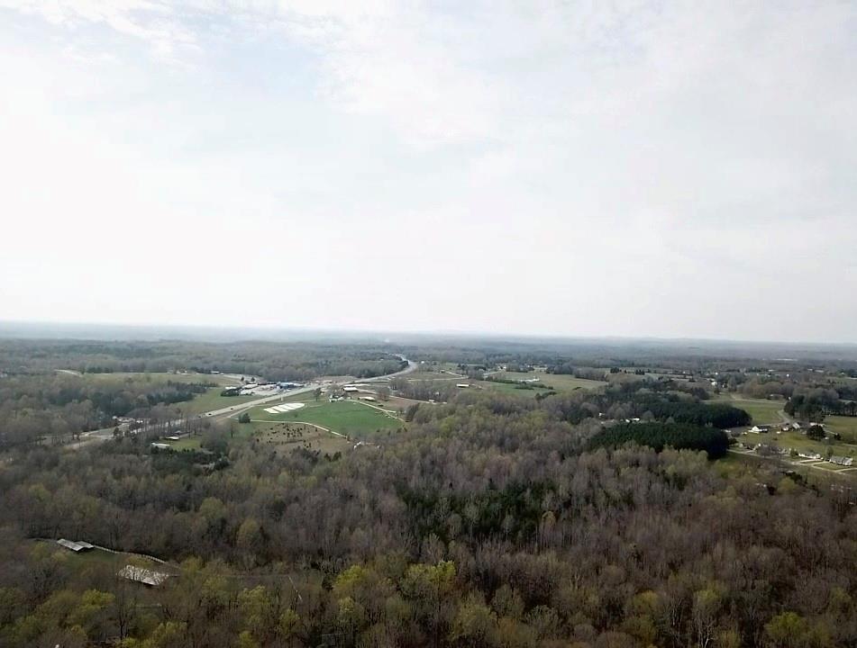 One of a kind development property near York.  54 +/- ac adjacent to Spring Lake Country Club and the City of York. (This allows possible annexation).  Sewer is on the property and city water is nearby.  Road frontage on Hwy 5 (500 + ft). Springlake Road (350Ft), Diane Road  Cul-de-sac frontage.  sewer runs along the creek on side property line. Current zoned as SFR-40. Wooded and rolling topography.  Pines on Springlake and presently being harvested (3 acres).