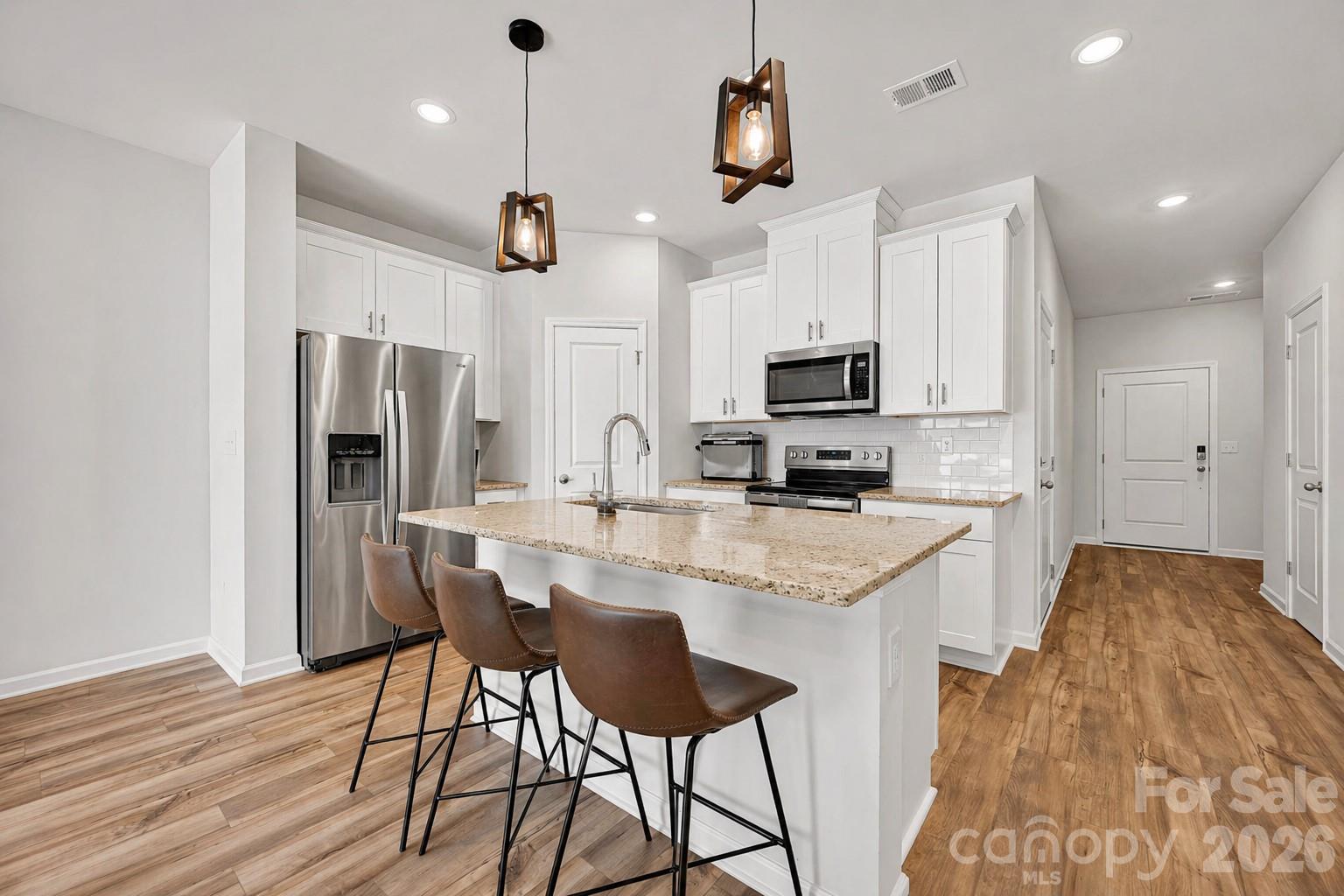 1 year of HOA dues paid by seller!!! Lawncare included!! Looking for a move-in ready home in Charlotte, North Carolina with modern style, a great location, and low upfront costs? This like-new 3-bedroom, 2.5-bath townhome offers over 1,600 square feet of thoughtfully designed space—perfect for first-time home buyers, investors, or anyone looking for a turnkey property. Qualified buyers may even take advantage of up to 100% financing plus $10,000 in closing cost assistance, making homeownership more attainable than ever. Inside, you’ll love the bright open-concept layout that seamlessly connects the kitchen, dining, and living areas—ideal for entertaining or everyday living. Upstairs features three spacious bedrooms with walk-in closets and a conveniently located laundry room. The location is hard to beat, just minutes from Uptown, South End, NoDa, Plaza Midwood, Charlotte Douglas International Airport, and the U.S. National Whitewater Center. Additional highlights include a one-car garage prepped for an electric vehicle, energy-efficient features, a transferable builder warranty, and meticulous one-owner care. If you’ve been searching for an affordable, low-maintenance home in Charlotte with strong rental potential or an easy place to call home, this one is worth a look.