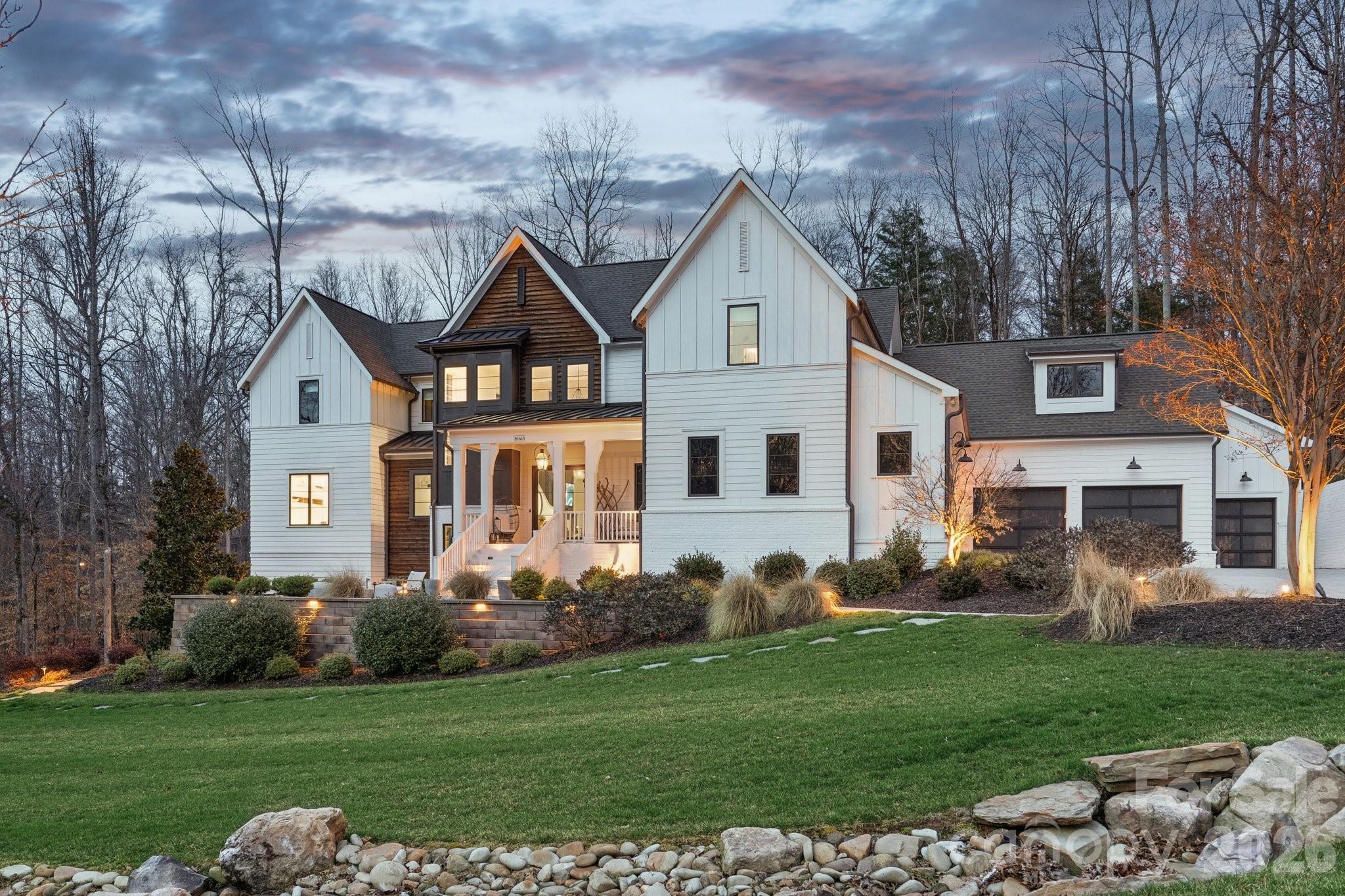 Exceptional luxury living in the highly sought-after River Run community of Davidson. Situated on a private 1.5+ acre estate lot, this stunning custom home blends elegant design, modern comfort, and resort-style outdoor living. Thoughtfully designed with expansive living spaces, high-end finishes, and seamless indoor-outdoor flow, the home offers both sophistication and functionality for everyday living and entertaining.

The chef’s kitchen features professional-grade appliances, a large center island, and custom cabinetry, opening to spacious living and dining areas filled with natural light. The main level includes a luxurious primary suite and guest accommodations designed for comfort and privacy, while additional living areas and flexible spaces throughout the home provide room for work, fitness, and entertainment.

Step outside to your private backyard retreat designed for year-round enjoyment. The grounds feature a custom pool with slide, pickleball court, basketball court, private putting green, and multiple gathering areas including a fire pit with seating, outdoor kitchen by the pool, and a wood-fired pizza oven—creating the ultimate setting for entertaining and recreation.

Additional highlights include a 4-car garage plus dedicated golf cart garage, beautifully landscaped grounds, and expansive outdoor living spaces. Located within the desirable River Run community offering golf, tennis, swimming, and scenic walking trails, all just minutes from charming downtown Davidson, Lake Norman, dining, and shopping.