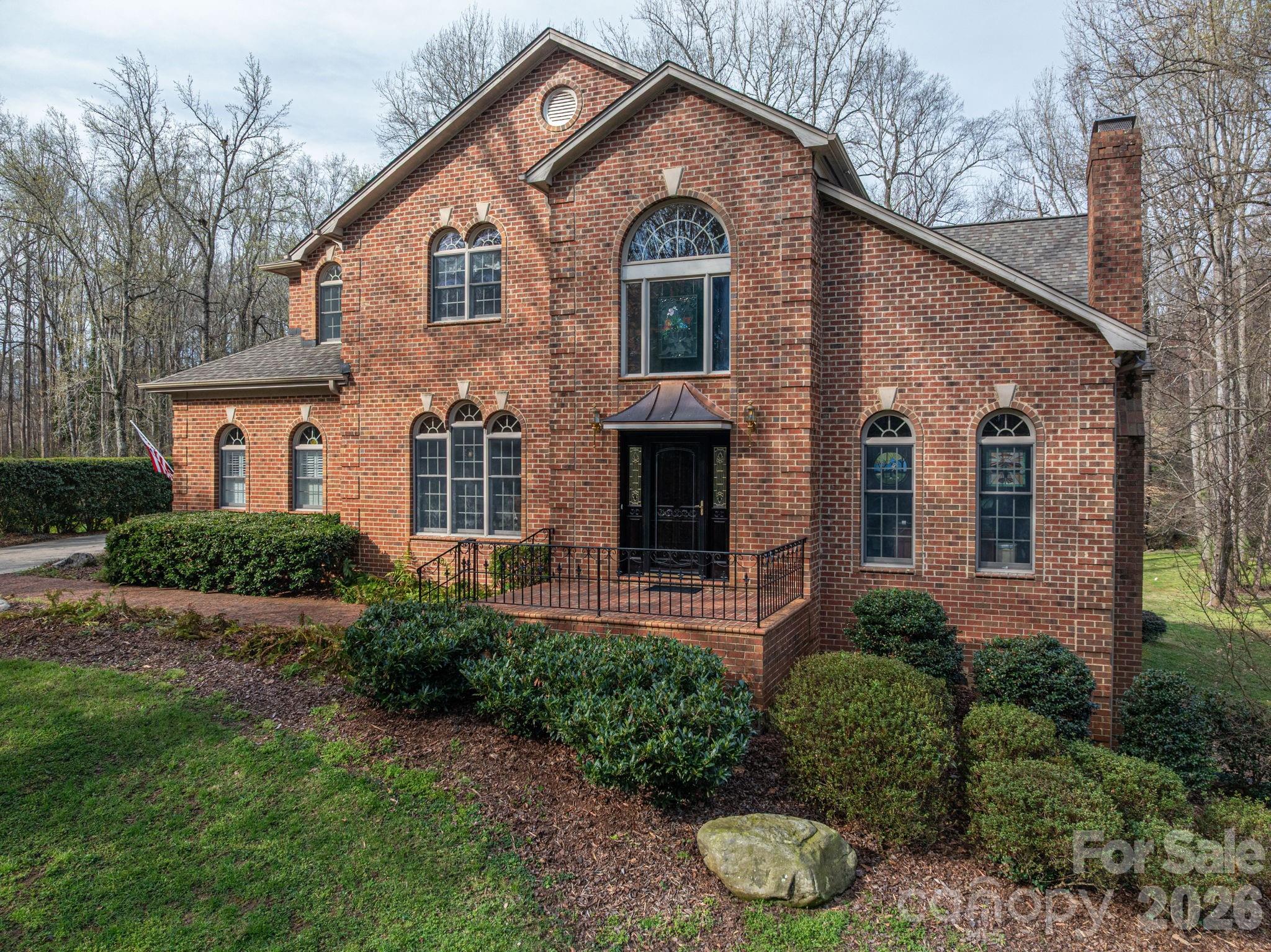 Seller is offering a $15,000 allowance for buyer's to conduct updates on the property at closing.  This luxurious 4 bedroom, traditional brick home is located in the highly sought-after Johnsfield subdivision. Roof is approximately 2 to 3 years old. You are greeted by a beautifully landscaped yard with lots of space and privacy in the back. Upon entering this lovely home you will find plenty of natural light and crown molding throughout. The dining room is located to the left of the foyer, and the office is off to the right. The large living room features a gas log fireplace and leads onto the expansive deck with Chippendale railing. Enter the ideal kitchen for those who like to entertain. The custom kitchen has a massive island with Kenmore Pro-elite stainless steel appliances and new windows. The laundry room has lots of counterspace to fold clothes and a handy laundry chute from the second floor. The primary bedroom suite is located on the first floor and has an ensuite bathroom complete with jetted tub, shower and double sinks. Two separate powder rooms on the main level allow added convenience for entertaining. There are three bedrooms upstairs and a bonus room. One bedroom has its own ensuite bathroom, and the other two bedrooms share a bathroom. The partially finished basement has potential for expansion or extra living space. The lower-level living room has a woodburning fireplace. This room opens onto a fenced dog run that is located under the upper deck. There are 2 workshops, and plumbing has already been installed on the back wall. This home has been well-maintained and is ready for its new owner.