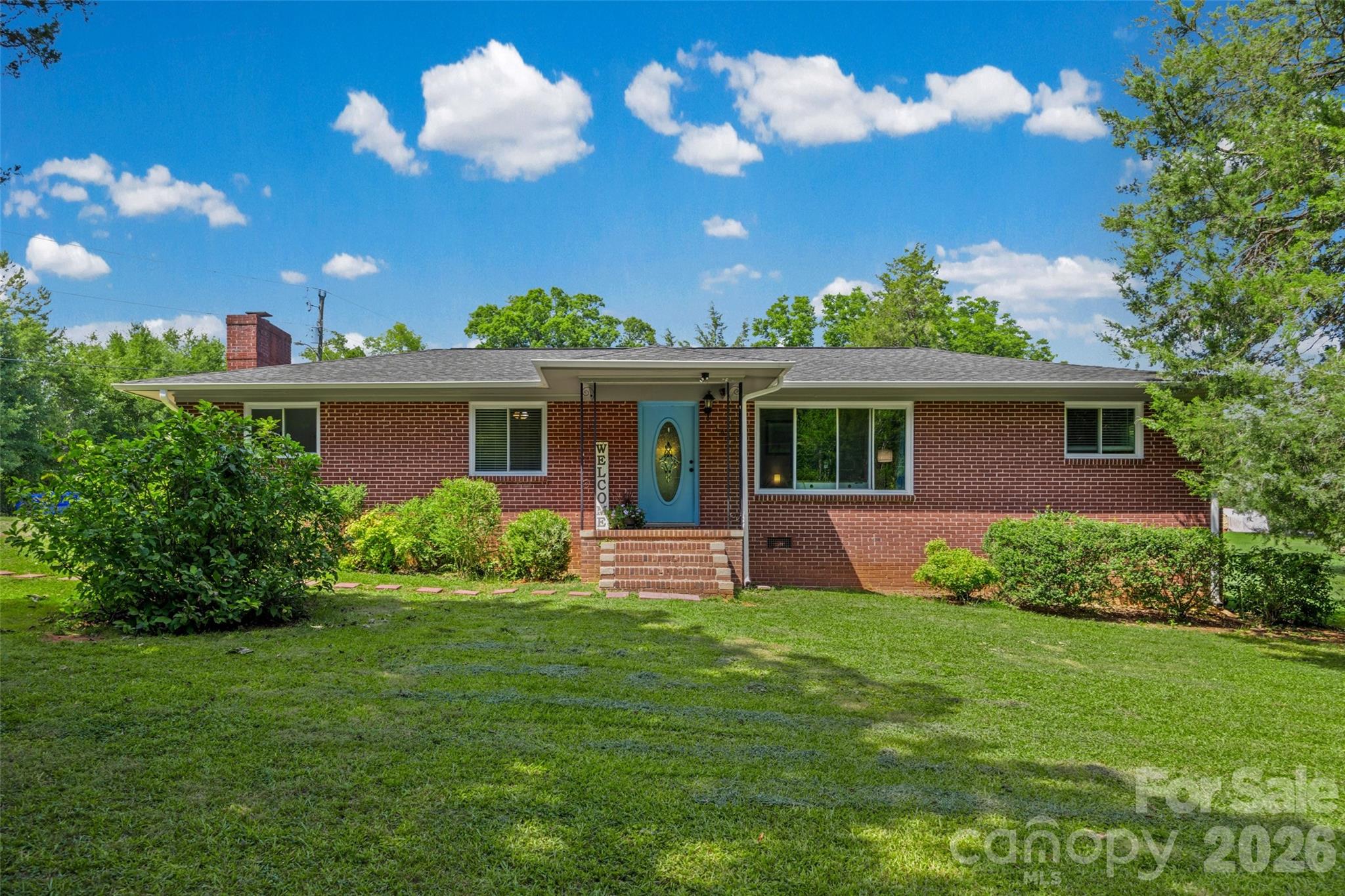 Welcome home to peaceful country living with the convenience of Rock Hill just minutes away. Situated on 1.17 acres, this charming all-brick ranch offers the perfect blend of comfort, character, and room to enjoy the outdoors.
Step inside to discover a beautifully remodeled kitchen featuring new cabinetry, updated countertops, stainless steel appliances, a newly added dishwasher, and an abundance of cabinet space to keep everything organized. Just beyond the kitchen, the inviting sunroom quickly becomes the heart of the home. With a cozy fireplace and new full-size sliding glass doors, it's filled with natural light and provides the perfect place to enjoy your morning coffee while overlooking the colorful landscaped flowers and raised flower beds.
The updated bathroom features a new shower, modern vanity, and a spacious linen closet, combining style with practical storage. Hardwood and luxury vinyl plank flooring flow throughout the home, offering easy maintenance with no carpet anywhere.
Outside, you'll find plenty of space for gardening, entertaining, or simply enjoying the privacy of your expansive yard. A detached one-car garage makes an ideal workshop, hobby space, or extra storage, while the large storage shed provides even more room for tools and equipment.
If you've been looking for a home that combines timeless brick construction, thoughtful updates, and a beautiful outdoor setting, this Rock Hill gem is ready to welcome you home.