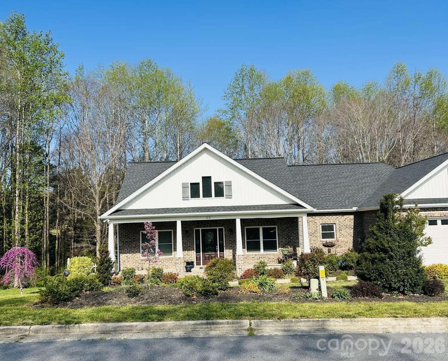 DEEDED BOAT SLIP - Enjoy lake life at Lake Hickory! Built in 2018, 2,229 Sq Ft. custom, one level 3 BR, 2.5 bath full brick home on 1.16 acres in the desirable Iswa Point Subdivision in the Bethlehem community. Only 20 minutes to downtown Hickory. The rocking chair front porch welcomes you as you step inside to craftsmanship details. Hardwood floors through most of the home including Master BR. Living room has a vaulted ceiling with wood beams and a gas fireplace. Attached sunroom. Additional living space off of the foyer can be used as a home office. Oversized kitchen and dining area featuring granite countertops with raised bar, abundant cabinets with built ins and a free-standing island. Master BR suite has 2 walk-in closets and the Master bath has a tile shower and oversized soaking tub. Lots of natural light throughout the home. Walk-in crawlspace w/concrete floor with plenty of storage. Private, wooded lot with nice landscaping and raised garden beds. Great for nature lovers.