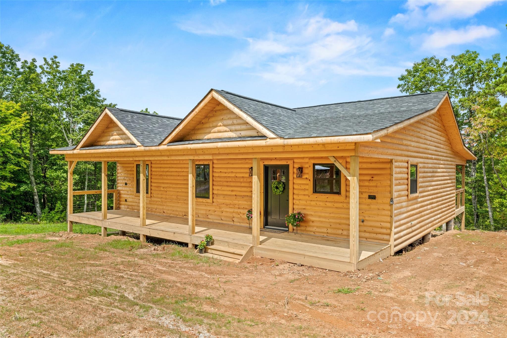 Escape to the serenity of the mountains with this charming 3BR/2BA rustic cabin. Nestled among the towering pines, this cozy retreat offers the perfect blend of comfort & natural beauty. Step inside to discover a warm & inviting living space adorned with 3/4" tongue & groove pine walls finished naturally. The kitchen features stainless steel appliances, ample granite counter space, & beautiful hickory cabinets to complete the rustic feel. The open living area boasts vaulted ceilings & a wood-burning fireplace. Throughout the cabin, pine LVP flooring adds to the rustic charm while offering durability & easy maintenance. A spacious deck beckons you to soak in the fresh mountain air while taking in the scenic beauty. Neighborhood features an in-ground pool w/clubhouse. Conveniently located near hiking trails & the South Mountain State Park, this mountain cabin offers endless opportunities for adventure, hunting, & exploration. Schedule a showing today & make this rustic retreat your own!