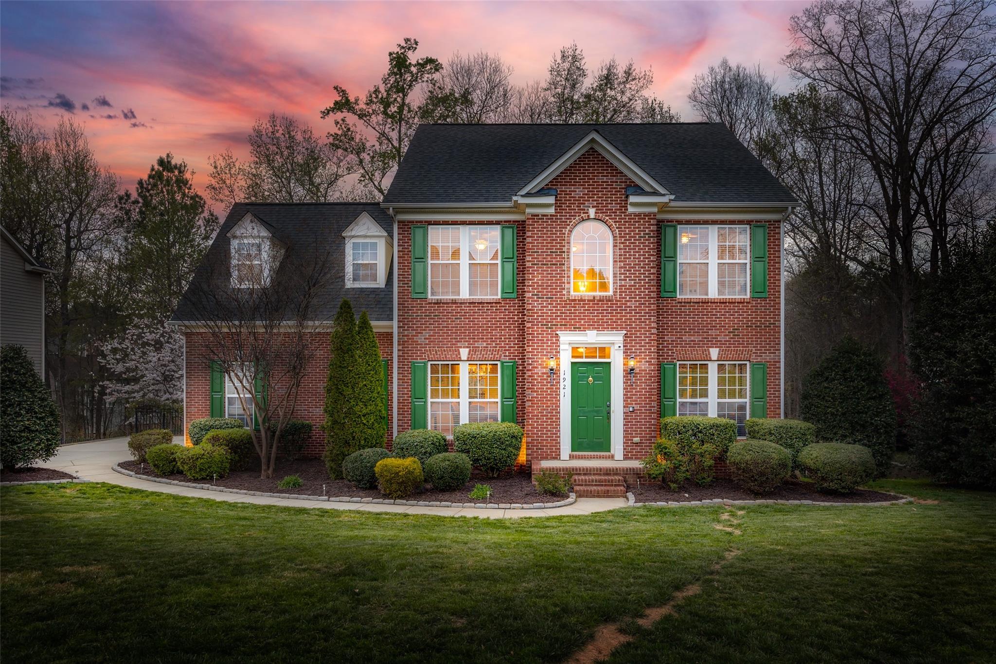 Nestled in a private backdrop of trees & a creek, this beautifully updated home in the desirable Sutton Place will leave you nothing short of impressed! Enjoy entertaining on the expansive deck w/ paver patio below, & retaining wall provides a level yard. As you enter on the gleaming hardwoods that run throughout (no carpet!), a gorgeous 2 story foyer flanked by an office w/ french doors & dining area greets you. The newly upgraded kitchen boasts gas range, herringbone backsplash, & more! Flowing into the great room you'll find a re-faced marble fireplace & sunroom to enjoy the view. All bathrooms in the home have been completely remodeled, incl the 1/2 bath. Upstairs the primary bedroom has dual closets & spa-like bathroom! The third floor has a huge bonus space! Oversized garage w/ sink. Refrigerator & w/d included. Too many upgrades to mention, be sure to check the features list! Sutton Place amenities incl pool, playground, & recreation area, as well as low SC taxes - welcome home!