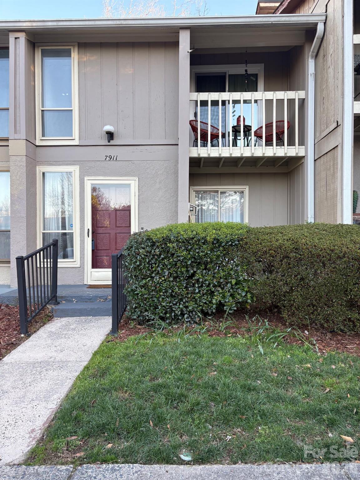 Beautiful 2-bedroom, 1.5-bath townhouse in the desirable Treva Woods community offering approximately 1,300 square feet of comfortable living space. This two-story home features tall ceilings and large windows that fill the space with beautiful natural sunlight, creating an open and airy feel perfect for relaxing or even showcasing your favorite houseplants. The main level offers a spacious living room with vaulted ceilings and a cozy wood-burning fireplace. The kitchen features white cabinetry, granite countertops, stove, range hood, and dishwasher, along with great functionality for everyday living. A convenient half bath is also located on the main floor. Upstairs, you’ll find two generously sized bedrooms, including one with access to a private balcony. The full bathroom is accessible from both the primary bedroom and the hallway. A laundry chute and main-level laundry closet add practical convenience, and the home includes a brand-new washer and dryer. Enjoy outdoor living on the private back patio with newly poured concrete, perfect for barbecuing, entertaining, or simply unwinding. New sliding doors were installed in 2023, and a newly installed ADT security system provides added peace of mind in this already welcoming community. Residents also enjoy access to the community outdoor pool. Two assigned parking spaces are included. Ideally located at the corner of Johnston Road and Highway 51, this home offers easy access to the hospital, shopping, dining, and everyday conveniences. HOA dues include common area maintenance. A wonderful opportunity to own a light-filled, move-in-ready home in a prime South Charlotte location.
