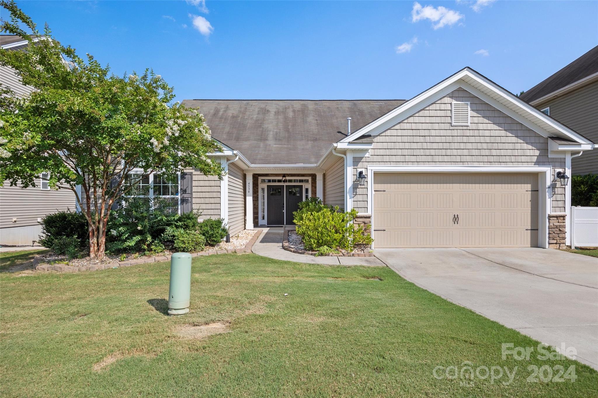 Step into this spacious 5-Bedroom, 3.5 Bath home where comfort meets style.  As you enter the Foyer, you will be greeted by natural light and a beautiful open floor plan. Exquisite Gourmet Kitchen with Bay Window, Desk and Pantry. Large Laundry Room.  The main level features the Primary Suite, with soaking tub and shower, and oversized walk in closet. Enjoy 2 additional bedrooms and shared bath on the main floor. Upstairs, discover 2 more bedrooms which can also serve as a versatile bonus space - ideal for a home office, playroom or media room.  Also features a 3rd full bath. Outside the amazing fenced backyard provides both privacy and a peaceful retreat with wooded views.  Entertain effortlessly with the outdoor kitchen and beautiful covered lanai, creating memorable gatherings amidst the backdrop of lush greenery.  This eco-friendly home is equipped with solar panels, offering sustainable energy solutions that reduce environmental impact and utilities.