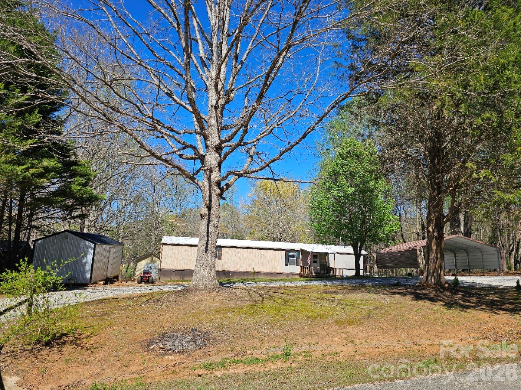 Welcome home to this charming 2-bedroom, 2-bath single-wide in the heart of Vale, offering peaceful country living on 0.81 acres. Priced under tax value, this property features a fully fenced in back that backs up to a tranquil creek, creating a private outdoor space perfect for gardening, pets, or simply enjoying nature.

A circle driveway, carport, and a powered outbuilding add convenience and versatility. The outbuilding, located in the backyard, even includes air conditioning, making it ideal for a workshop, hobby space, studio, or extra storage. The outbuilding in the front yard is not included.

Whether you’re looking for your first home, downsizing, or investing, this property is an exceptional opportunity with plenty of usable space and features that are hard to find at this value. Come see all the potential this country retreat has to offer!