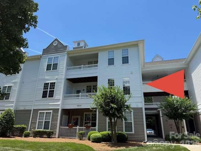 Stunning second-story condo in Oakhurst, fully renovated in June 2026! This bright, open-concept 2 bedroom, 2 bath home features luxury vinyl plank flooring throughout including bathrooms and all closets all installed in 2026. You'll love cooking with the brand new stainless steel kitchen appliances! Laundry is conveniently located off kitchen and even the washer and dryer are brand new. The spacious primary suite includes a luxurious bath with soaking tub, separate shower, dual vanity sinks, and massive walk-in closet. Cozy up by the fireplace or relax on your covered balcony overlooking the common area. Brand new satin doorknobs and hinges throughout add a sleek finishing touch. The building offers both elevator and stairs for easy access. Community amenities include pool, playground, picnic area, and walking trails. Close to shopping, restaurants and I-77. Truly maintenance free living. Move-in ready and absolutely gorgeous!