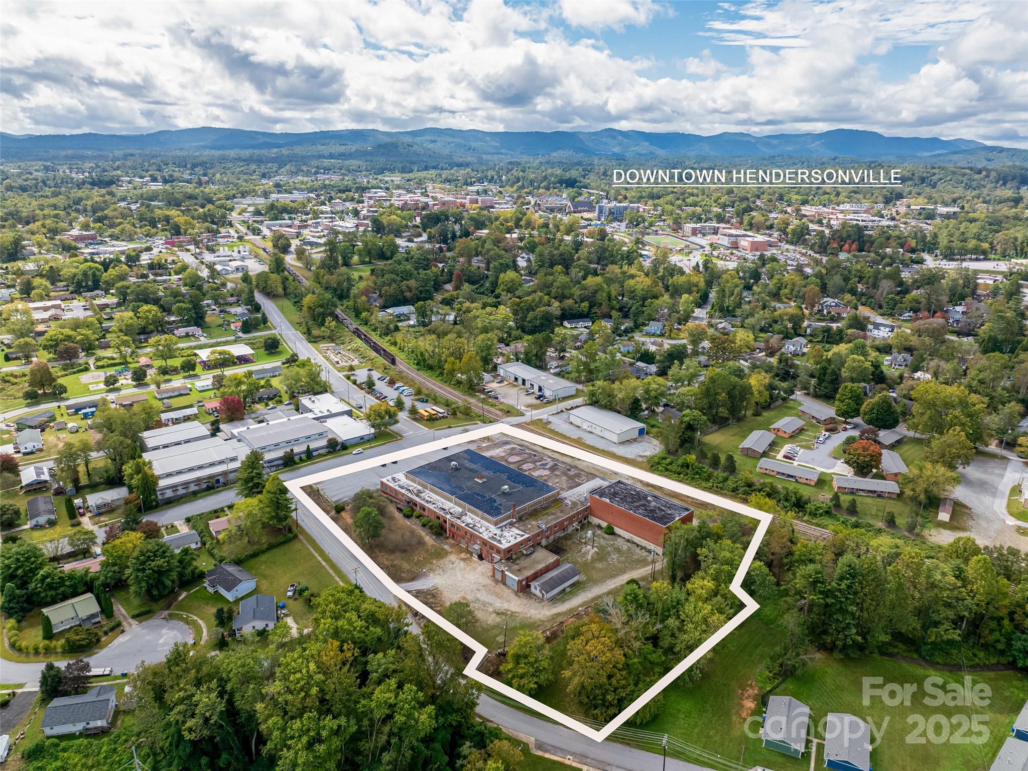 Discover the Oriole Mill, over 72,000SF of Highly Adaptive Space, Minutes from Downtown Hendersonville. This two-story facility offers unmatched flexibility for industrial/manufacturing, or adaptive reuse projects. Flexible zoning with versatility within the structure, the site features numerous drive-in doors, dock doors with a full-length loading deck along a formerly active rail spur, and access on all four sides. Located near the Oklawaha Greenway, the property also includes additional land that could be ideal for parking or laydown yard. Whether you're looking to scale operations or reimagine a legacy space, Oriole Mill is a rare opportunity in a rapidly growing market.