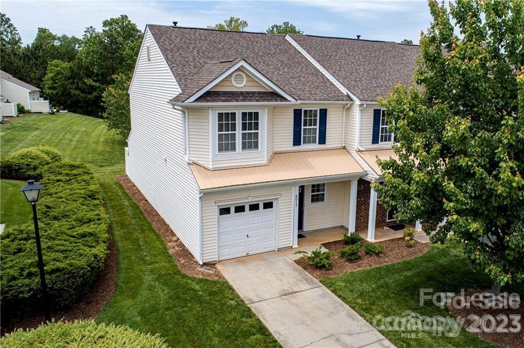 Gorgeous End Unit Town Home in the convenient area of Indian Land, close to Ballantyne and Fort Mill! 2 bedrooms and 2.5 baths with a garage.  Spacious Family Room, fireplace with gas logs, dining area, open kitchen, laminate wood flooring downstairs, new carpet on the stairs and the upstairs loft, walk in closets and two full baths upstairs, plus a convenient loft area and laundry closet. Lawn care included , and a community pool, volleyball court, basketball court and sidewalks. Private back patio, storage unit.  Convenient to many area restaurants, movie theaters and shopping. Washer and dryer included.