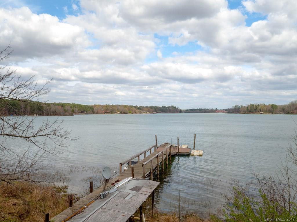 Unbelievable, open water views of Mountain Island Lake!! Keep the existing home and renovate or tear down and start fresh on this picturesque piece of heaven right outside of Charlotte in Mount Holly.