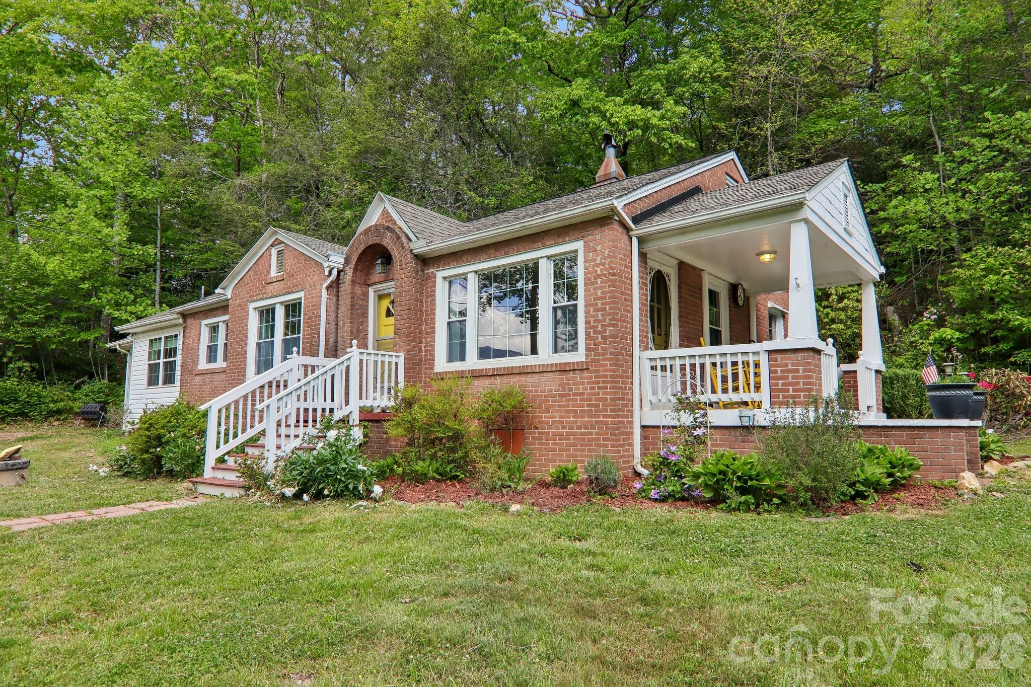 Welcome to your own slice of mountain paradise, nestled in the heart of the stunning South Toe Valley. This charming two-bedroom, one-bathroom cottage is brimming with character and priced to move quickly making it an exceptional opportunity for buyers seeking affordable mountain living without sacrificing charm.

Inside, you'll immediately notice the beautiful hardwood floors, complemented by graceful archways that lend a timeless, storybook quality to every room. This home feels like a warm hug from the mountains themselves, offering cozy proportions and thoughtful details that larger homes simply cannot replicate.

Outside, the property truly shines. Extensive landscaping showcases a wonderful variety of flowers and herbs, creating a vibrant tapestry of color and fragrance throughout the growing seasons. A dedicated greenhouse offers year-round growing potential  imagine harvesting fresh herbs in January while snow dusts the surrounding peaks. Just across the road, creek frontage beckons with the soothing sounds of flowing water, creating an idyllic spot for afternoon picnics and quiet moments of reflection.

The location strikes a perfect balance between peaceful seclusion and convenient access. The charming town of Burnsville is just minutes away for shopping and dining, while the legendary Blue Ridge Parkway offers world-class scenic drives practically from your doorstep. The nearby South Toe River provides additional recreation, and attractions like Emerald Village add to the region's appeal.

Do not let this cottage gem slip away. Schedule your showing today and discover mountain living at its most enchanting.