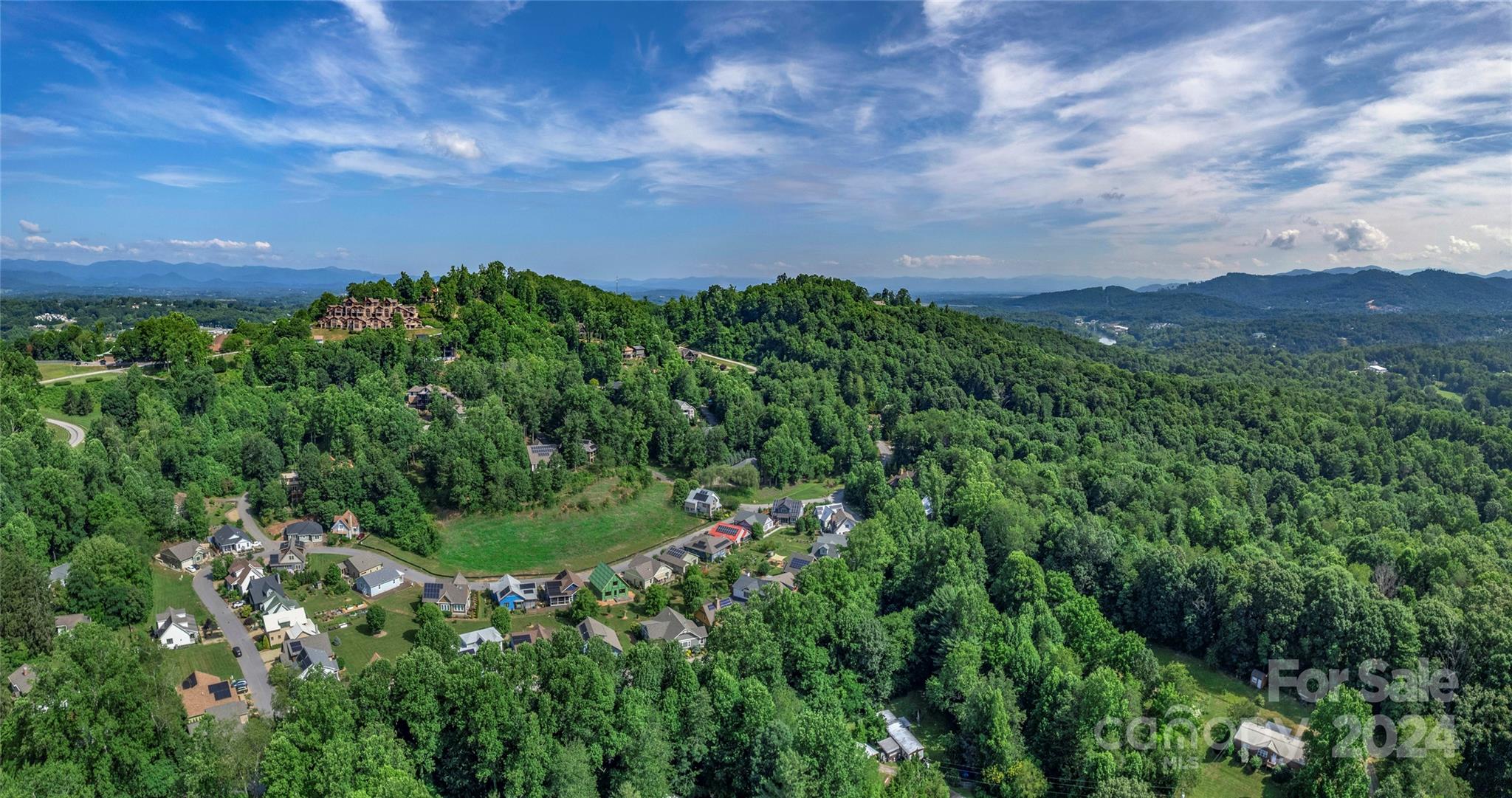 Discover Crest Mountain, a rare chance to shape Asheville's luxury real estate landscape. This prestigious gated community, just minutes from downtown and the River Arts District offers an ideal blend of accessibility and mountain tranquility. Spanning 68 acres with 126 prime homesites, Crest Mountain features stunning mountain and city vistas with old-growth forests. Its development-ready infrastructure includes paved roads, fiber optic and city water/sewer services, enabling immediate project launch. Perfectly positioned to tap into Asheville's thriving real estate market and ever growing demand for luxury mountain homes. Seize this opportunity to revitalize Asheville's next iconic community.