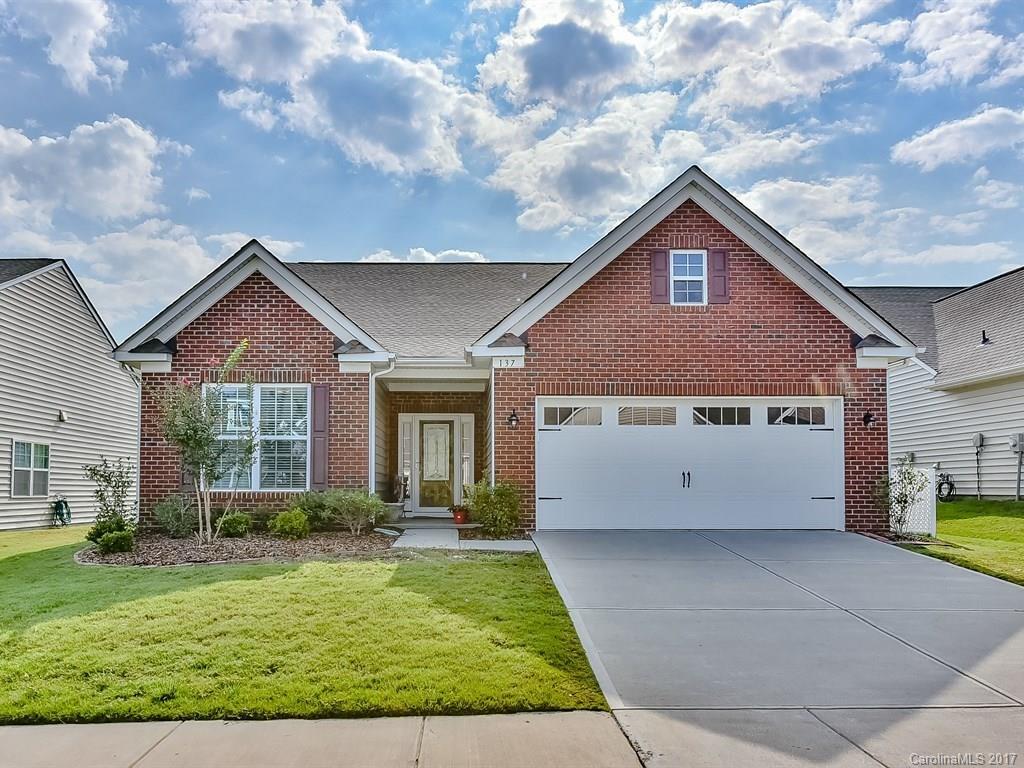 Charming 1.5 story house with 3bd/3ba plus a loft in a lovely neighborhood with excellent amenities.  Bedroom upstairs has its own full bath and can be used as a guest suite/second master.  Beautiful home with excellent features including a kitchen you will love, wood floors throughout most of the downstairs and a covered and extended patio along with a fenced yard.  Motivated Sellers.  Bring all offers!