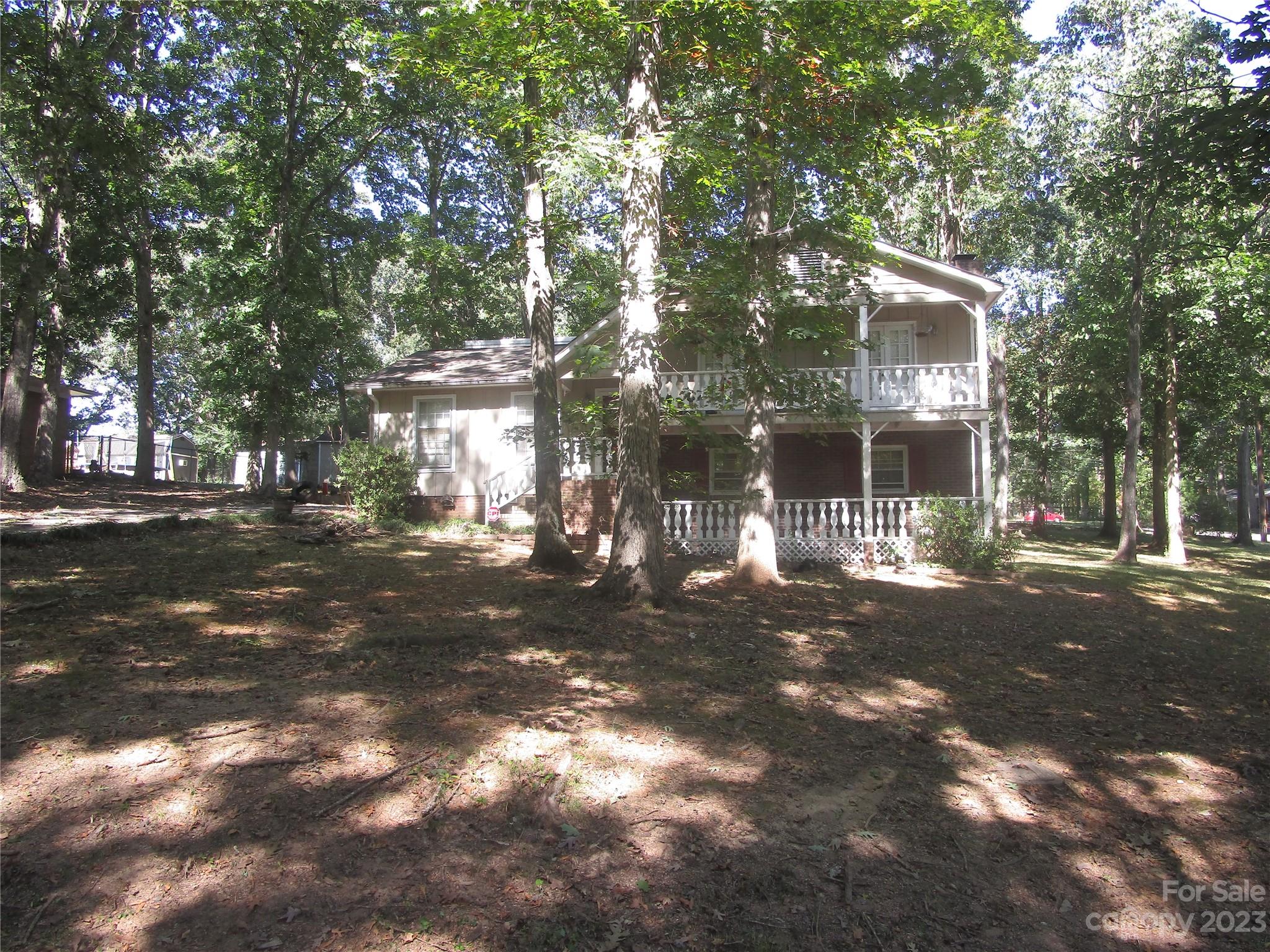 Space galore and amazing potential! 4 full bedrooms/3 full bathrooms (a lower level family/flex room that could be additional living area or 4th bedroom.) Lower level also features full bathroom, laundry room and exterior door, which allows many potential uses or options. Main level den is spacious and has a spiral staicase leading to bonus or office area or rec area, which is noted as an additional 162 sq.ft. Upper level has 3 bedrooms and 2 bathrooms. 2 upper level secondary bedrooms have balconies/porches with nice views. Deck accessible from den/main living area. Kitchen has been updated with granite countertops and appliances and also offers nice dining area. Great location just around the corner from Wingate University. Don't miss out on this one! PRICE REDUCED! 
Super new price: $314,900 !!