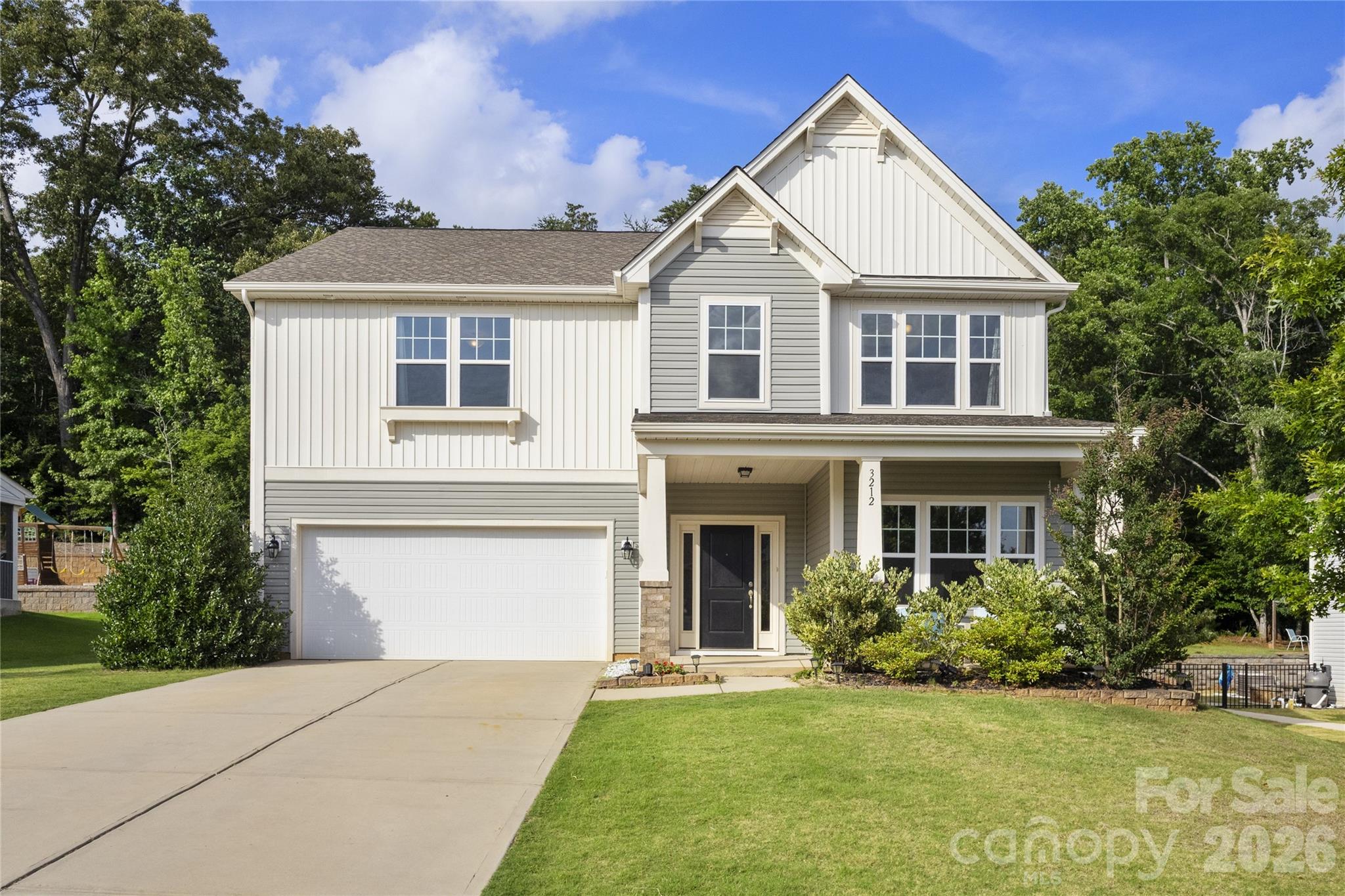 Welcome to this beautiful 5-bedroom, 3.5-bath home in the gated Prestwick community, where comfort, space, and a private outdoor setting come together beautifully. From the moment you step inside, you’ll appreciate the open layout, inviting great room with gas log fireplace, and thoughtful floor plan that offers flexibility for today’s lifestyle.
The main level features a rare and valuable guest bedroom with its own full bath, making it an ideal retreat for visitors, extended family, or anyone needing a private first-floor space. The kitchen is both functional and stylish with granite countertops, gas cooking, breakfast bar, walk-in pantry, and butler’s pantry, all flowing easily into the formal dining room and living areas.
Upstairs, a spacious bonus room provides extra room for recreation, media, or play, along with four additional bedrooms including the oversized primary suite. The primary bath features dual vanities, a garden tub, separate shower, and a large walk-in closet. A second-floor laundry room adds convenience right where you need it most.
Step outside and discover one of this home’s biggest highlights: the backyard oasis. Backing to a private wooded area, the outdoor living space is designed for both entertaining and unwinding, featuring a large lanai, additional patio space, and a fire pit area perfect for evenings under the stars. All of this is tucked inside a desirable gated community just minutes from Ballantyne, Carolina Place Mall, and countless shopping and dining destinations.