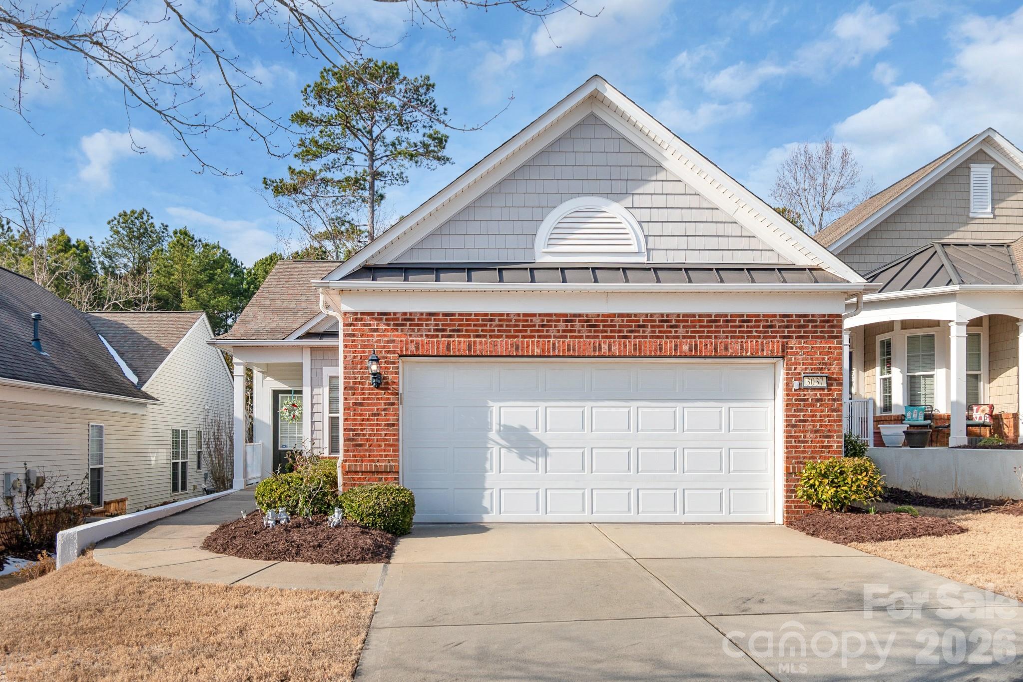 MOTIVATED SELLER AND PRICED TO MOVE!  NEW CARPET in living room and primary bedroom! Best Value in Sun City so hurry before it's GONE! Welcome home to this charming 2-bedroom, 2-bath residence in the highly sought-after Sun City Carolina Lakes. Enjoy peaceful living with a private wooded backdrop that offers rare privacy and serene views. Ideally located within walking distance to shopping, restaurants, grocery stores, and the community clubhouse, this home delivers both convenience and connection. Experience low-maintenance living with access to resort-style amenities, social activities, and everything that makes Sun City Carolina Lakes a premier active adult destination.