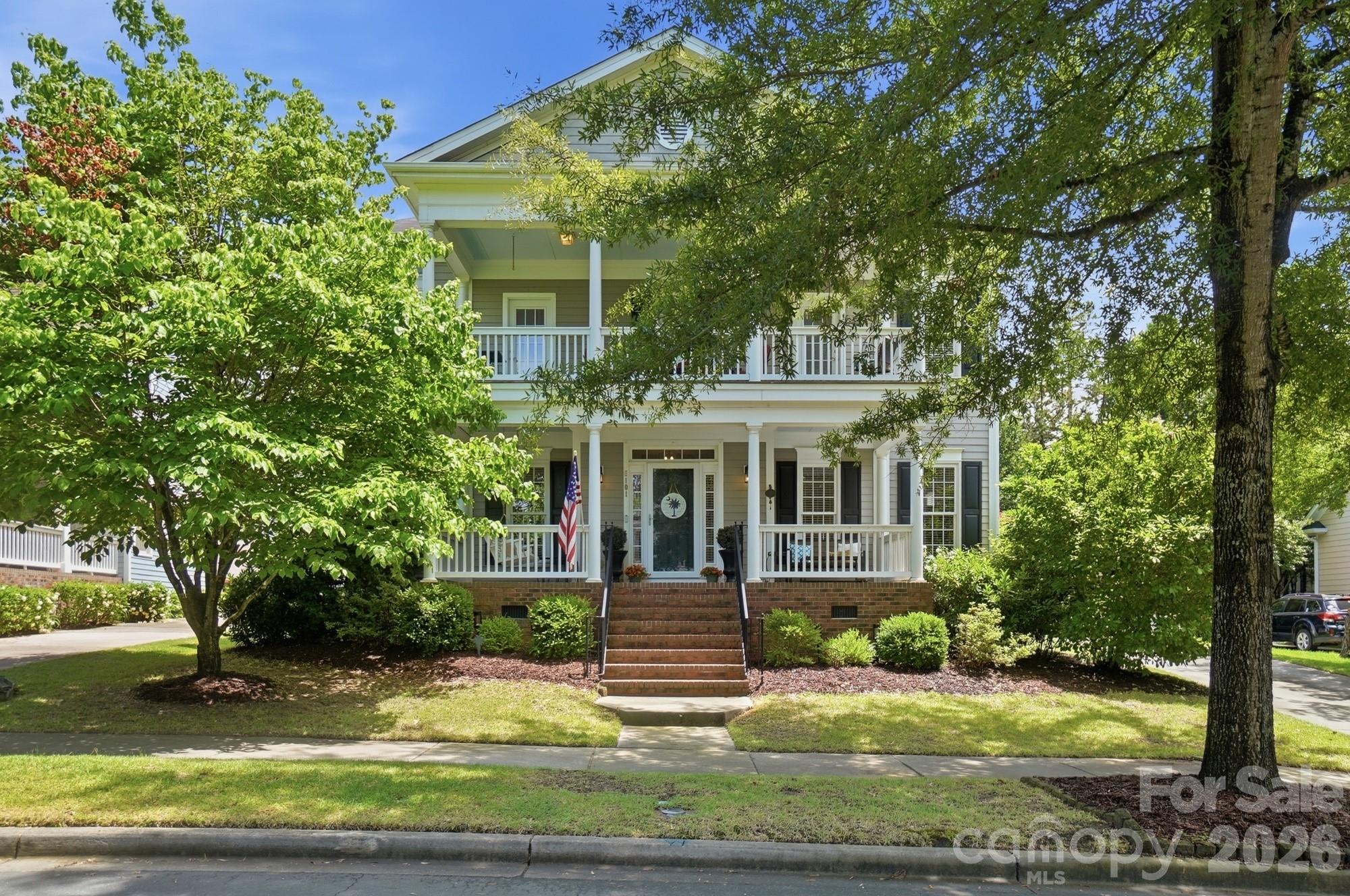 Welcome to Baxter Village living! With 3,447 sf, 4 bedrooms + Bonus, and 3.5 baths, this beautifully maintained home offers privacy, charm, and exceptional functionality, and backs up to a peaceful wooded preserve and a connected trail system. Double front porches create classic Southern curb appeal and inviting outdoor living spaces. Inside, fresh interior paint gives the home a bright, updated feel throughout. The welcoming kitchen opens seamlessly to the spacious great room and features a large center island perfect for gathering and entertaining. A dedicated main-level study provides the ideal work-from-home space or quiet retreat. Upstairs, the spacious primary suite is complemented by a second ensuite bedroom, ideal for guests or multigenerational living. Generous walk-in closets provide abundant storage throughout the home. The huge bonus room with a closet offers endless flexibility as a 5th bedroom, media room, playroom, home gym, or guest suite. Enjoy all that Baxter Village has to offer, including pools, tennis courts, playgrounds, clubhouse, sidewalks, and walking trails, plus the vibrant Baxter Town Center with local shopping, popular eateries, coffee shops, and fitness options just moments away. Conveniently located near charming Downtown Fort Mill and with easy access to Uptown Charlotte, this home offers the perfect blend of community, convenience, and lifestyle within the highly sought-after Fort Mill School District.