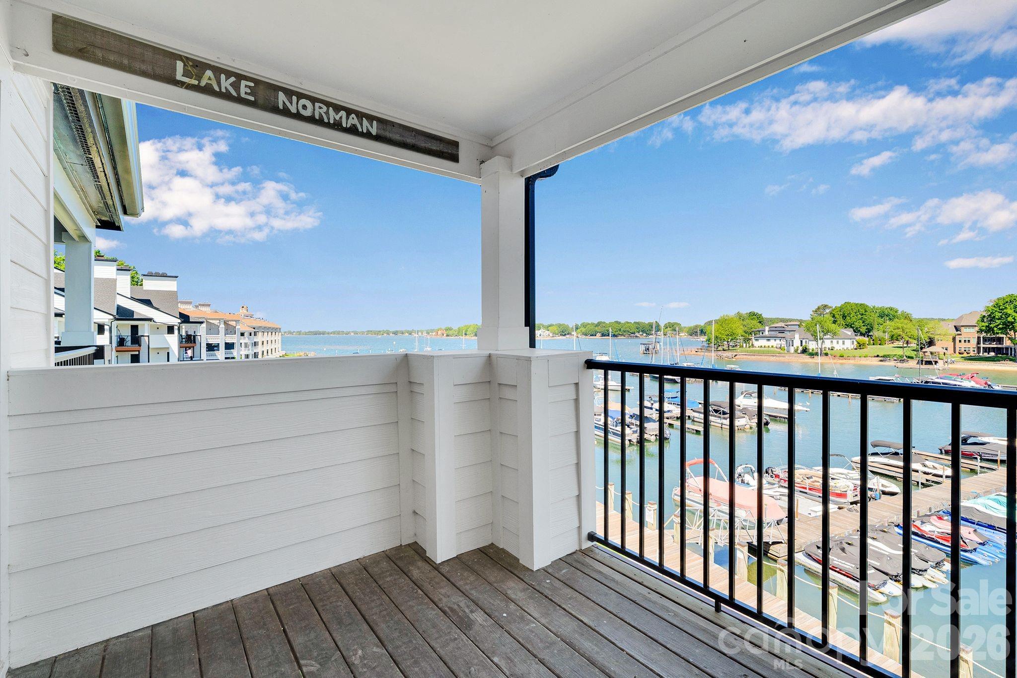 Welcome to effortless Lake Norman living in this beautifully renovated third-floor condo in the recently refreshed Arbors in Vineyard Point—where big-water, sunset views set the tone for everyday life. With 2 bedrooms and 2 full baths, the home feels bright and inviting thanks to fresh paint, new flooring and lighting throughout, and soaring vaulted ceilings in the Great Room and Primary Bedroom. Start your mornings with coffee on the deck as the lake sparkles below, then unwind in the evening as the sun melts into the water—perfect for quiet moments or easy entertaining. Both baths have been updated with new vanities, toilets, and fixtures, and the kitchen shines with freshly painted cabinets and new hardware. Enjoy peace of mind with community-wide exterior improvements including landscaping, updated siding and railings, exterior lighting, fresh paint, a new roof, and columns. Spend your weekends at the pool, meet friends for a match on the tennis courts, and take advantage of nearby Lake Norman access, plus convenient shopping and dining.