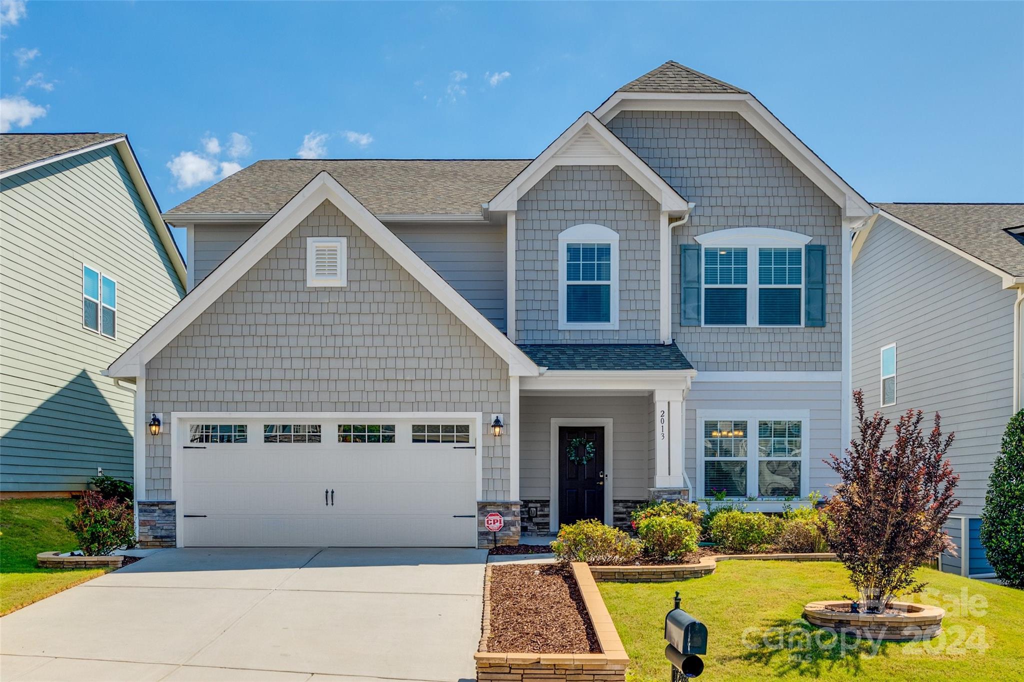 Experience the epitome of luxury living in this meticulously maintained, like-new, 5 bedroom, 3 full bathroom two-story home in Tega Cay. Step inside to find an inviting layout with gleaming luxury vinyl plank floors, custom molding and abundant natural light. The gourmet kitchen is a chef's dream with granite countertops, stainless steel appliances and tile backsplash. Retreat to the spacious primary suite with a spa-like ensuite bath featuring a dual vanity sink, garden tub and stalled shower. Upstairs, three additional spacious bedrooms and full bathrooms offer ample room for guests. The in-law suite offers privacy on the main floor. Outside, enjoy a landscaped backyard complete with a custom pergola that's fully wired for electrical, TV mount and custom pull down shade to provide a backyard oasis. Plus, a fully insulated and finished oversized 2-car garage with epoxy flooring, providing space for storage and hobbies. Enjoy all the amenities available in this vibrant community.